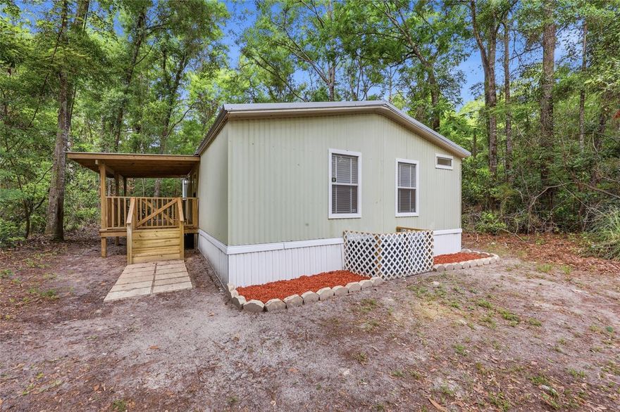 Tucked away on a heavily wooded and private lot in the highly sought-after Three Rivers Estates community, this completely renovated 2BR/2BA doublewide on almost an acre offers the perfect blend of modern updates and North Florida outdoor living. Practically everything in the home is brand new, including a new roof, new flooring, fresh interior paint, new cabinets, granite countertops, stainless steel appliances, updated fixtures, and more—making this property truly move-in ready.Surrounded by mature trees for added privacy and shade, the property also features a nice metal shed for additional storage, tools, or outdoor equipment. Whether you’re looking for a full-time residence, weekend retreat, or vacation rental opportunity, this property checks all the boxes. Located in the heart of Three Rivers Estates, residents enjoy access to multiple private neighborhood parks along the Santa Fe River and Ichetucknee River, with nearby boat ramps, swimming areas, and endless opportunities for kayaking, tubing, fishing, and enjoying the crystal-clear springs that make this area so desirable. Several of the neighborhood river parks are just minutes from the home, giving you quick and easy access to the water and outdoor recreation year-round.
Conveniently located near Fort White, High Springs, and some of North Florida’s most beautiful springs, this is your opportunity to enjoy the peaceful river lifestyle with all the hard work already done.