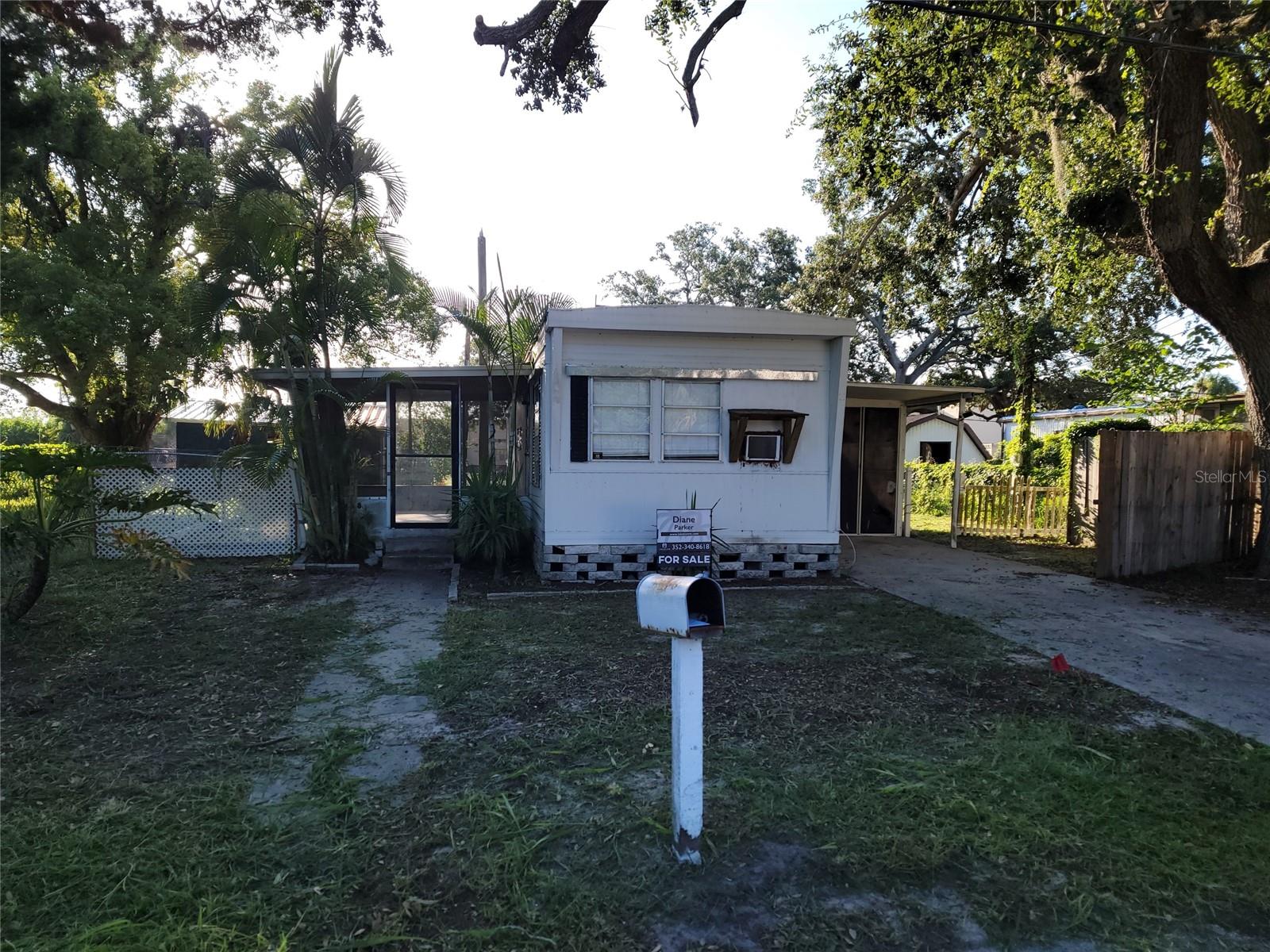Location Location!!! Walk to Downtown New Port Richey. 1 bedroom 1 bathroom fully renovated mobile home on your own lot. Home was flooded in the 2024 hurricane season. Home has new walls with wainscoting and fresh paint. The electric and plumbing are new. There is luxury vinyl flooring throughout. Windows have all new blinds. Kitchen has new cabinets and granite counters. Bathroom has a new commode and vanity with marble countertops. Walk-in shower has an insert. Bathroom has a built-in closet. Bedroom has a large walk-in closet. Home has two window a/c units. Green Key Beach is less than 2 miles away. Yard is completely fenced. There is a vinyl enclosed storage area with washer and dryer hookup. There is a screened in porch. Property has mature oaks. Home sits on a private dead-end road with a pond at end of road. All the renovations were permitted and inspections passed. There are no open permits. Perfect for an investment property or a little get away spot.
