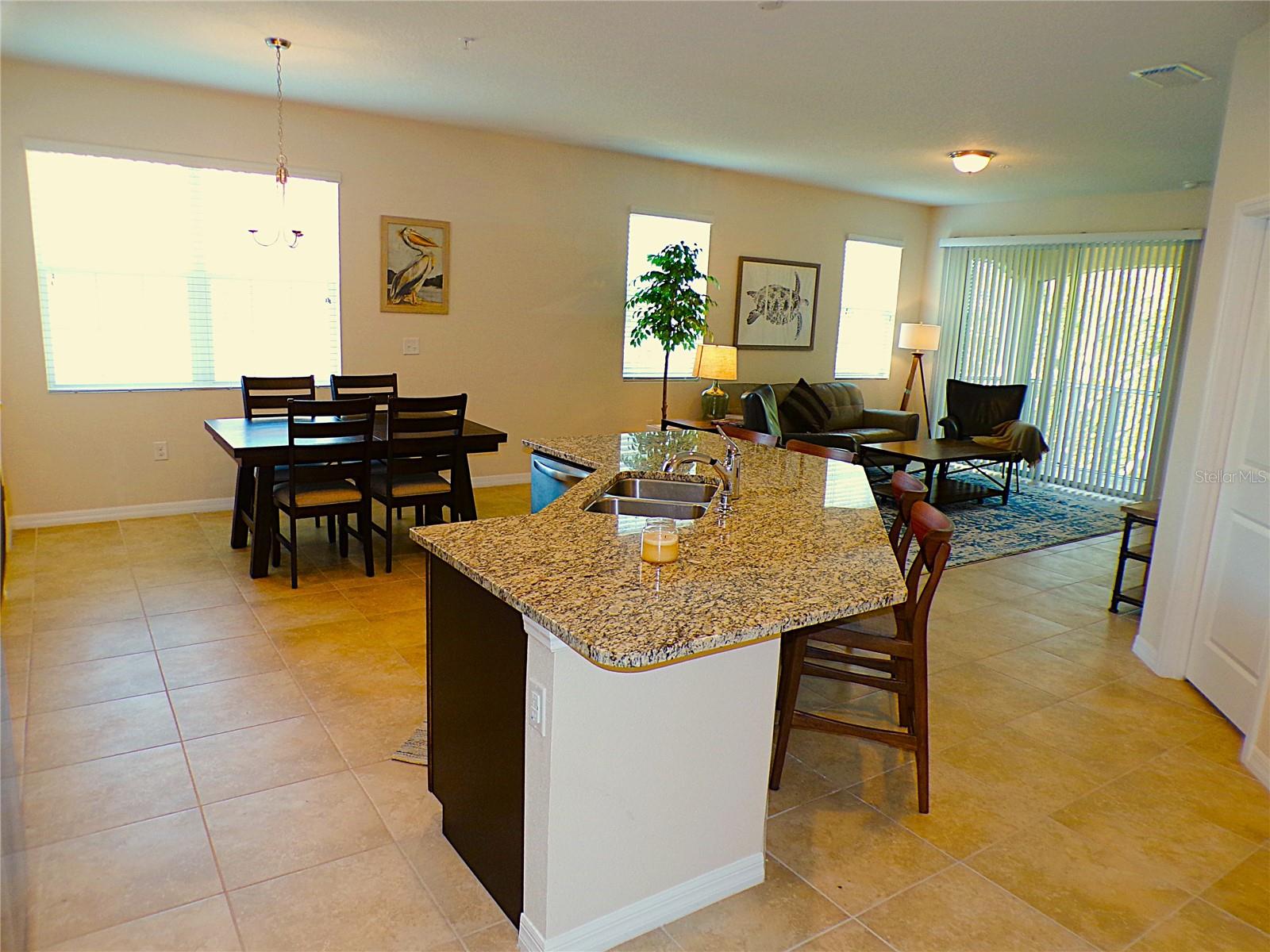 Welcome to your new home at 3642 Enclave Way #101, a beautifully maintained and move-in ready 2nd-floor condo nestled within the desirable gated community of Soleil in Sarasota, Florida. This spacious residence offers 3 bedrooms, 2 bathrooms, and the convenience of a 1-car garage located on the ground floor, providing both secure parking and additional storage space. Step inside and be greeted by an inviting open-concept living area, seamlessly connecting the kitchen, dining, and living spaces, creating a bright and airy atmosphere perfect for entertaining friends and family or simply relaxing after a long day. The well-appointed kitchen features granite countertops, stainless steel appliances, an island and a large pantry. The primary suite serves as a true retreat, boasting a generously sized bedroom, a private ensuite bathroom with dual sinks, a walk-in shower and a spacious walk-in closet. Two additional bedrooms provide versatility, ideal for guest rooms or a hobby room. As a bonus, a den located off the kitchen/living area, provides a private, dedicated workspace for homework or your daily, remote office needs. A conveniently located laundry closet with washer/dryer included adds to the ease of living. Beyond the comfort of your own home, Soleil offers a resort-style lifestyle with an array of fantastic amenities. Take a refreshing dip in the sparkling community pool, work up a sweat in the fitness center, socialize with neighbors in the clubhouse, or let your furry friend enjoy some off-leash fun at the dedicated dog park. The meticulously maintained grounds and landscaping further enhance the community's simple and clean appeal. This prime Sarasota location puts you within easy reach of shopping, dining, entertainment, and the world-renowned beaches of the Gulf Coast, yes those beaches...Lido and Siesta Key. Enjoy the vibrant arts and culture scene, explore the numerous parks and nature trails, or simply soak up the Florida sunshine. Make this home yours for a minimum of 12 months, water and sewer and trash collection is included, it is ready for you immediately. No waiting. No pets. Don't miss the opportunity to call this beautiful condo your new home! Schedule a private showing today.