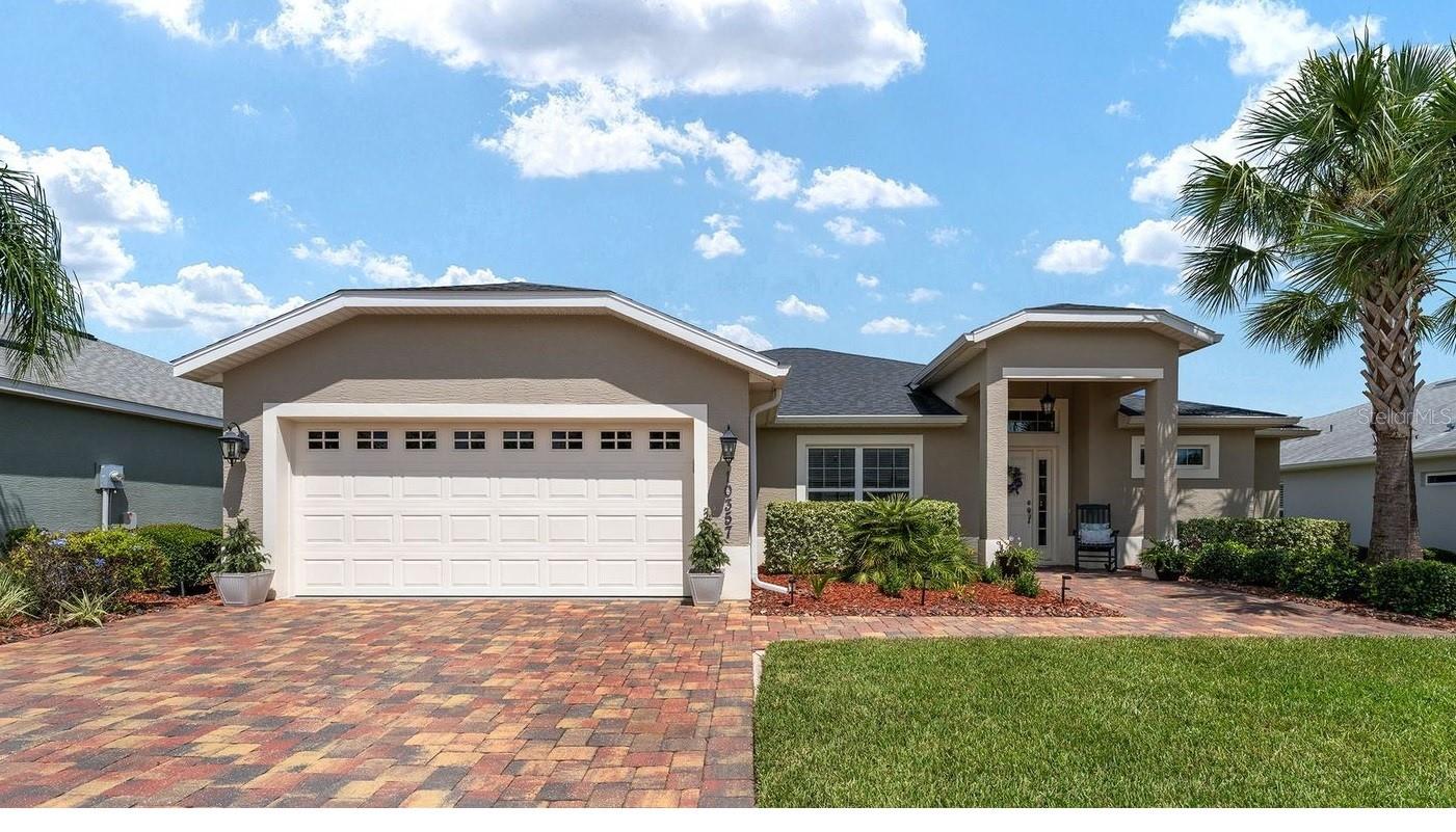 Stunning 4-bedroom 2 and a half bath home in the highly sought-after Gated Community of Lakeside Landings. The spacious Oakmont open floor plan provides the space you need for entertaining, hosting guests, or rooms for the hobbyist. One of the best locations in the area. Just a 12-minute golf cart ride to Sumter Landing, 15+ minutes to Spanish Springs, and less than 10 minutes to most of the conveniences in the area – several grocery stores, medical, dental, the new Home Depot, Lowe's, Costco, the future Target, and so much more. The home welcomes you with its mature landscaping, maintenance-free lawn, STUCCO exterior, and PAVER walkway and driveway. Inside, you'll find an OPEN-CONCEPT with 10-foot HIGH CEILINGS in the main living areas. This home has wood-grained CERAMIC TILE FLOORS throughout the main living areas. The large open EAT-IN kitchen has WHITE cabinets with crown molding accents, STAINLESS STEEL APPLIANCES, a large ISLAND/breakfast bar, and GRANITE COUNTERTOPS. The primary bedroom has an en-suite bathroom with dual sinks on the GRANITE-topped vanity, a linen closet, a tiled ROMAN shower, and TWO WALK-IN closets. The split-bedroom layout includes three generously sized guest rooms, a shared bath, and a separate linen closet, perfect for guests or family. Enjoy your extended LANAI, which overlooks the private backyard that has more than enough room for a pool. The 2-car garage offers ample space for your golf cart and other personal vehicles. Additional storage for seasonal items over the garage space. Large indoor laundry room with utility sink, LARGE-CAPACITY washer and dryer, and extra cabinets for storage. The home has a prewired security system. The HOA takes care of exterior pest treatment, lawn care, and irrigation (free lawn watering) to ensure a maintenance-free lifestyle. This is a TRULY GATED COMMUNITY featuring impressive wrought iron gates, boasting two pools including a relaxing RESORT-STYLE POOL, two in-ground Jacuzzis, a clubhouse with a library, billiard room, a FULL FITNESS CENTER, space for community events, a card room, putting greens, playground, basketball, tennis, and pickle ball courts exclusively to residents. If you enjoy kayaking and sunshine, you will love the access to Lake Miona. NO BOND!