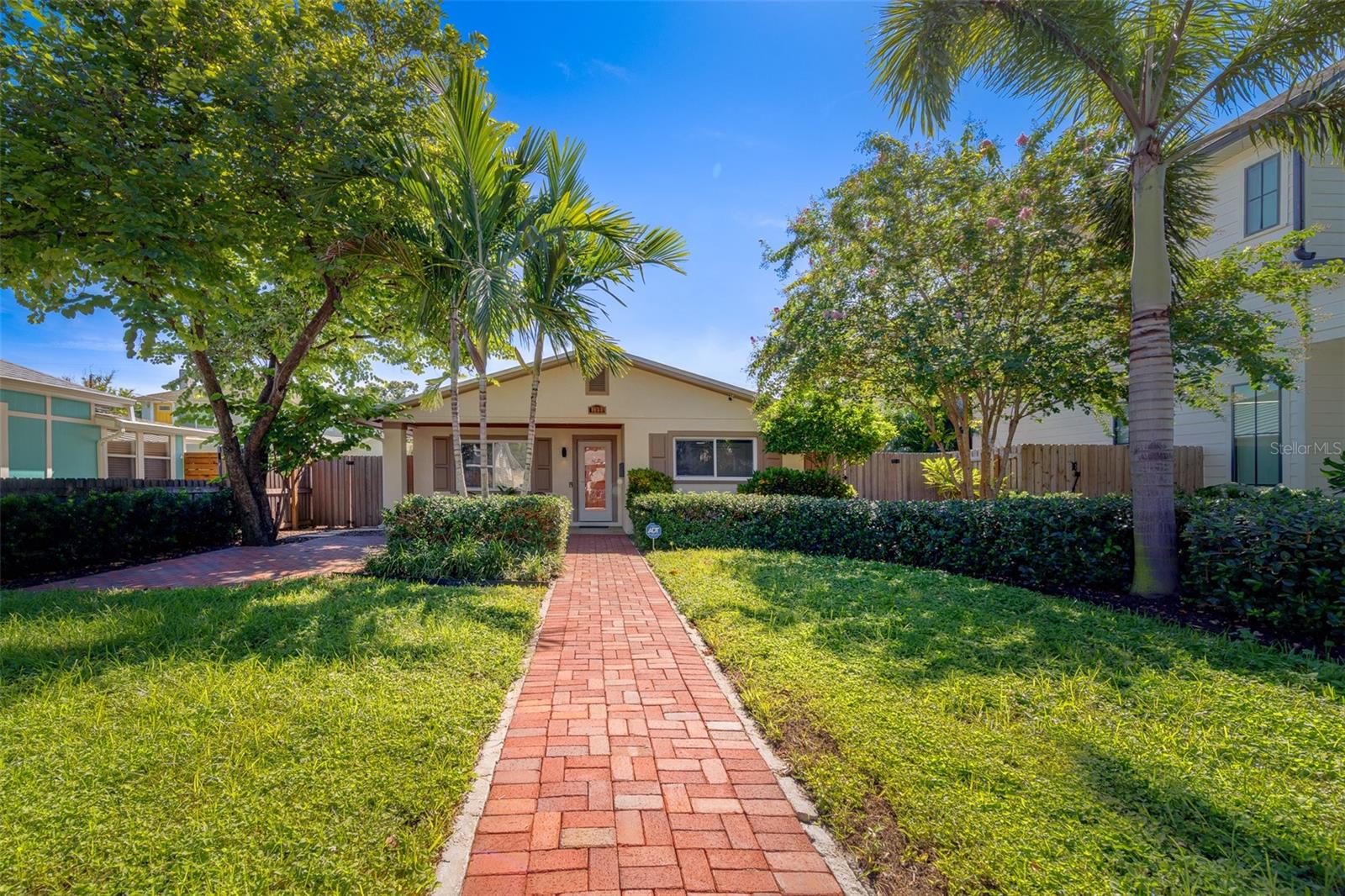 Welcome to this beautifully updated 3 bedroom, 2 bath pool home in the sought-after Euclid / St. Paul’s neighborhood of St. Petersburg. Thoughtfully remodeled inside and out, this property combines timeless charm with modern convenience and peace-of-mind updates. Step inside to find a bright white kitchen that opens to the main living area, showcasing new cabinetry with soft-close storage, sleek countertops, backsplash, shelving, LED and strip lighting, and a large farmhouse-style sink with filtered tap. Premium appliances include an induction stove and French door refrigerator, plus a convenient cabinet pantry and USB charging options. The open living area features custom built-ins, updated ceiling fans, and LVP flooring that flows throughout the home. The primary suite offers dual closets, upgraded electrical/HDMI/internet hubs for wall-mounted TV, and an ensuite bath featuring new fixtures, floating and recessed storage, a skylight tube, and original retro blue tile for a touch of vintage character. The second bathroom has been fully remodeled with a new tiled shower, flooring, glass enclosure, and floating storage. Two additional bedrooms each feature updated fans, closets, and HDMI hubs, offering flexible space for guests, office, or den. The home’s functionality shines in the redesigned laundry room, complete with a laundry sink, removable wood countertop, storage shelving, tankless water heater, hurricane impact door, and newer washer/dryer (2021). Multiple recent system upgrades provide lasting value: 2024 metal roof (with transferable warranty), 2024 HVAC with UV light filter, all-new insulation and ductwork, updated electrical panel with whole-home surge protector, new interior drywall, baseboards, doors, hardware, fixtures, and blackout/shade roll-down window treatments. Additional features include a metal hurricane shutter system, Philips Hue smart lights on the front and back porch, and upgraded RGBW LED interior lighting. Enjoy outdoor living with a screened lanai overlooking the pool, a fully fenced backyard with mature landscaping, a built-in fire pit (2022), irrigation system with rain gauge and Sunrise Irrigation membership, and new pool equipment (pump 2023, panel 2021/22). Exterior paint was refreshed in 2021, hardscaping and fencing installed in 2022, and the yard boasts an orchid tree with pink and white blooms and a rare grafted hibiscus that flowers in three colors. This home is offered with numerous extras, including hurricane shutters and hardware, hose and accessories, pool tools, storage cabinets, firewood, and bins. All this, set on tree-lined streets just minutes to vibrant Downtown St. Pete, waterfront parks, and I-275 for easy access across Tampa Bay. With style, substance, and prime location, this move-in ready home offers an exceptional lifestyle.