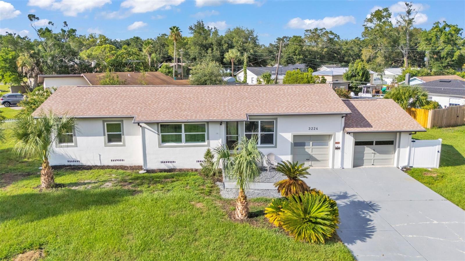 New listing FOR SALE!
Check out this Fantastic Remodeled home on a large corner lot in a desirable South Lakeland with no HOA! You will LOVE the location and the meticulous remodel work! You can move right in this home! Everything has been remodeled top to bottom in stylish and luxury finishes!
The open floor plans include a spacious living room, dining room, and kitchen along with 3 bedrooms, and 2 bathrooms. The spacious primary suite features 2 closets and a private ensuite bathroom with an oversized luxury shower.
The brand new kitchen is the heart of this home featuring stylish shaker cabinets, beautiful quartz countertops, ample counter space, bar seating, newly upgraded stainless steel appliances, new backsplash tile, luxurious modern bar lights, and a beautiful view to the spacious backyard.
This home sits on a stately corner lot with a huge front yard and backyard. You will also appreciate the ample parking with a wide driveway, 2 garages, and there is also a long concrete pad in the backyard. This can be used as an awesome patio or as a two vehicle parking pad in back to hide your boat and camper etc. (The owner likes to pull their car around back.) They just installed a brand new vinyl privacy fence too.
The two garages are fantastic. It is rare to find a split two car garage with a block partition and door. You can use this as a traditional garage or this set up makes for an easy transition to an extra suite or bonus space. It has huge potential and could be used for a variety of purposes, such as a home office, home gym, theatre room, man cave, game room, additional bedroom, or whatever your needs are. This could even be converted to a private in-law suite perfect for multigenerational living.
The many updates and upgrades within the last year include: New roof, New flooring, New kitchen, New light fixtures, New bathrooms, New plumbing fixtures, New windows, New doors, fresh paint, upgraded AC, upgraded electrical, New stainless steel appliances, New upgraded refrigerator, New exterior lighting, New low wattage security night lights around each external wall just installed, New vinyl fence, and much more!
You will LOVE living so close to all of Lakeland’s favorite spots! This home sits in a highly desirable location walking distance to Lake Hollingworth, the Cleveland Heights Golf course, public tennis courts, the amazing Common Ground playground, New YMCA, many desirable community parks, dog park, walking trails, and much more. You will love living just steps from the Cleveland Heights Golf Course & restaurant to enjoy fun golfing or good food and drinks with family and friends. The 27 hole course is open to the public and features a restaurant, bar, full-service Pro Shop, golf instruction, and practice areas. This home is also just a short drive to downtown Lakeland, Florida Southern College, Southeastern University, shopping, dining, and more.
This one is really special! Call today!