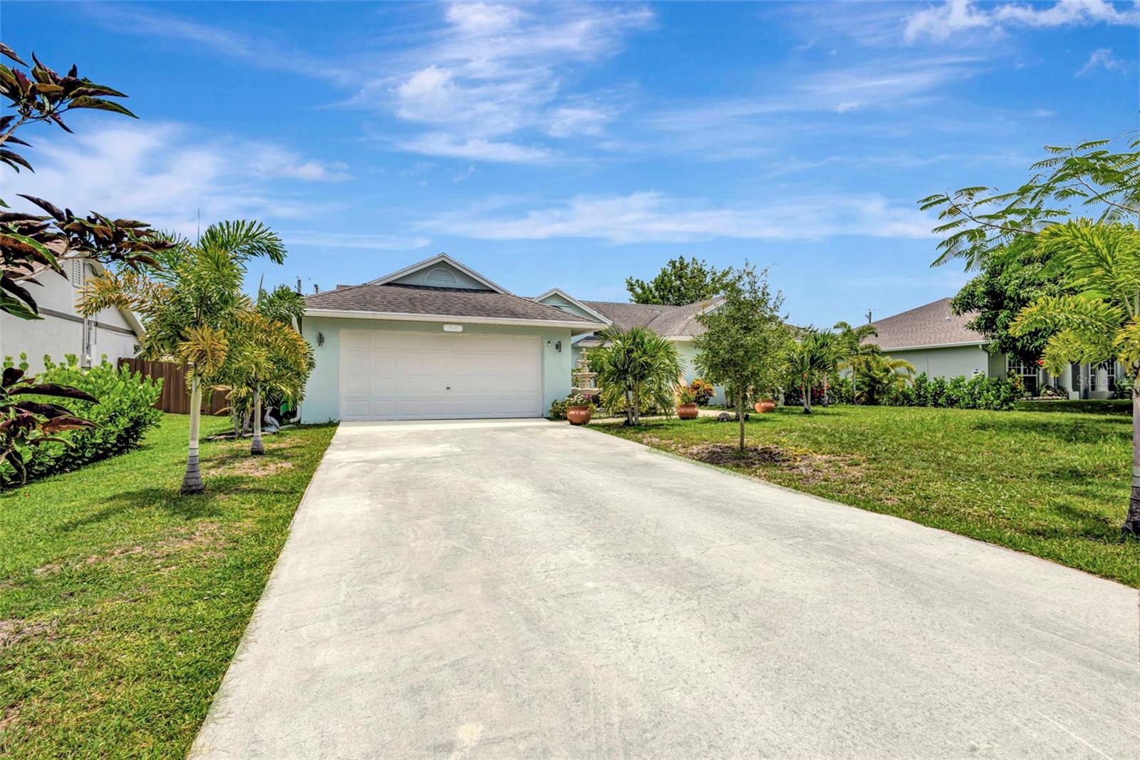 Welcome to your piece of Paradise located at just 20 minutes from the beach, and less than 10 minutes from the Turnpike. This meticulously maintained property boast a versatile layout that accommodate many decoration styles. Featuring 3 bedrooms, 2 bathrooms, 2-car garage, inside laundry room, formal dining room, kitchen/family room combo, tile/laminated flooring, and an oversized screened lanai overlooking a beautifully designed paved patio. The stunning landscape includes fruit trees and exotic plants, providing endless entertainment for nature lovers. The kitchen counts with stainless still appliances, modern backsplash, breakfast bar, and wide windows ideal for family interaction while enjoying the lanai during special celebration. AC replacement to be credited at closing. The master suite counts with two linen closet plus a walking closet to keep everything in place. The master bathroom has dual vanity with makeup desk, garden tub & shower combination for a delightful spa-like experience. Schedule your showing today and get ready to meet your new forever home.