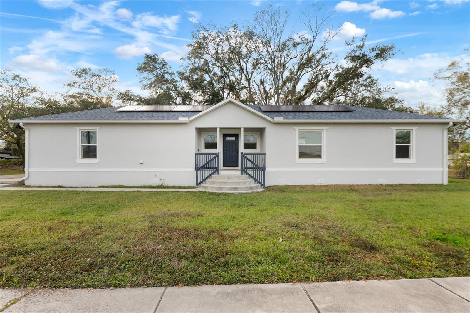 This 3 bedroom 2 bath 1 car garage home with a wide-open floor plan is on a 50x146 corner lot located in the growing downtown Plant City and is directly across from a park. Chefs kitchen w an 8ft center island, custom crafted kitchen & bath cabinets granite countertops. Stainless steel appliance, energy-efficient LED can lights throughout, Argon Gas filled double-paned windows. This home has solar panels. No HOA or CDD and 5 minutes from I-4 for easy access to dining and shopping.