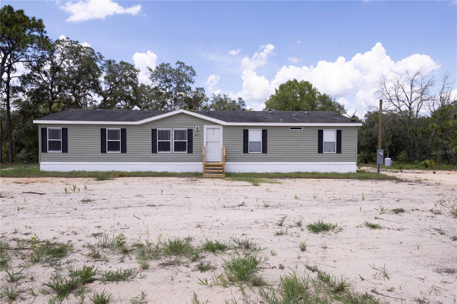Welcome! This charming home with NO HOA presents an excellent opportunity to make your own. Boasting 1,680 sq ft under air, this 3BR / 2BA, plus a versatile office, is nestled on a spacious one-acre lot. Recent upgrades include a brand new septic system (2025), well (2025), A/C unit (2025), and underground utilities, ensuring peace of mind and modern convenience. Step inside to discover an open floor plan that seamlessly combines the kitchen and family room—perfect for entertaining friends and family. The three bedrooms are generously sized, complemented by an additional room ideal for an office, guest space, or fit any personal needs. The bathrooms are thoughtfully designed, with the master featuring a relaxing tub and walk-in shower, and the guest bath offering a convenient shower-tub combo. Additional interior highlights include ceiling fans throughout, a cozy wood-burning fireplace in the living area, and an interior laundry room for added convenience. Don’t miss your chance to own this amazing home on a serene acre of land. Schedule your private tour today and experience everything this wonderful property has to offer!