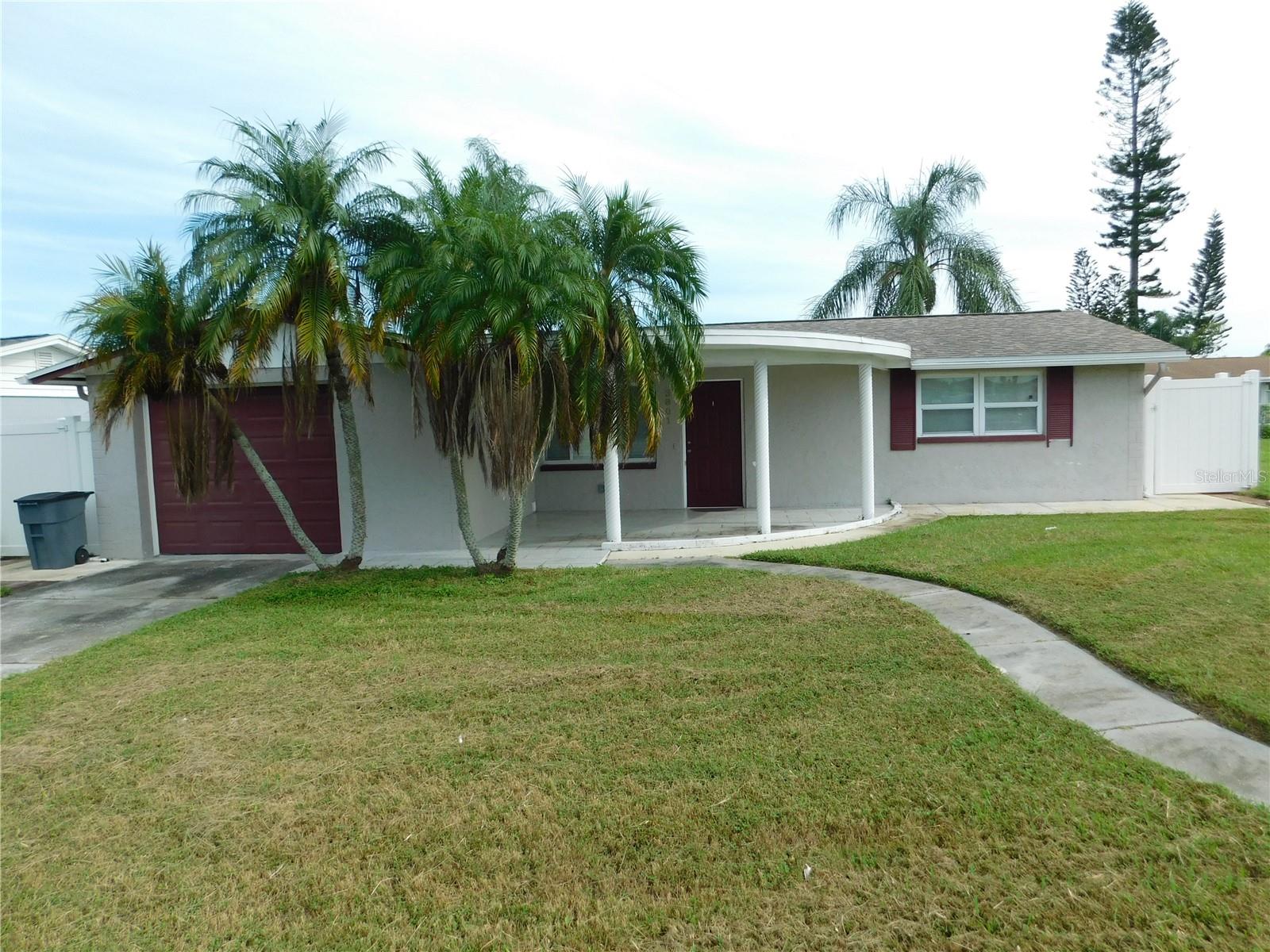 Stunning 2 beds, 1.5 baths single family home available for sale in Holiday. This property boast a renovated kitchen featuring wooden cabinets paired with granite countertops offers a classic and modern look. Porcelain tile throughout. Enjoy privacy and security with the durable vinyl privacy fence enclosing the rear yard, creating a perfect space for outdoor entertaining or relaxation. Whether you're seeking a permanent residence or an investment opportunity, this property provides the flexibility you desire. Centrally located in Holiday; just 0.7 miles from US 19. Convenience is at your doorstep with supermarkets, dining, and entertainment less than 1.5 mile away.