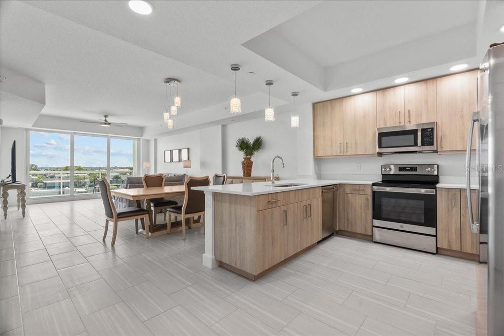 Photo of 415 Island Way #303, Clearwater Beach, FL 33767 (MLS # TB8383596)