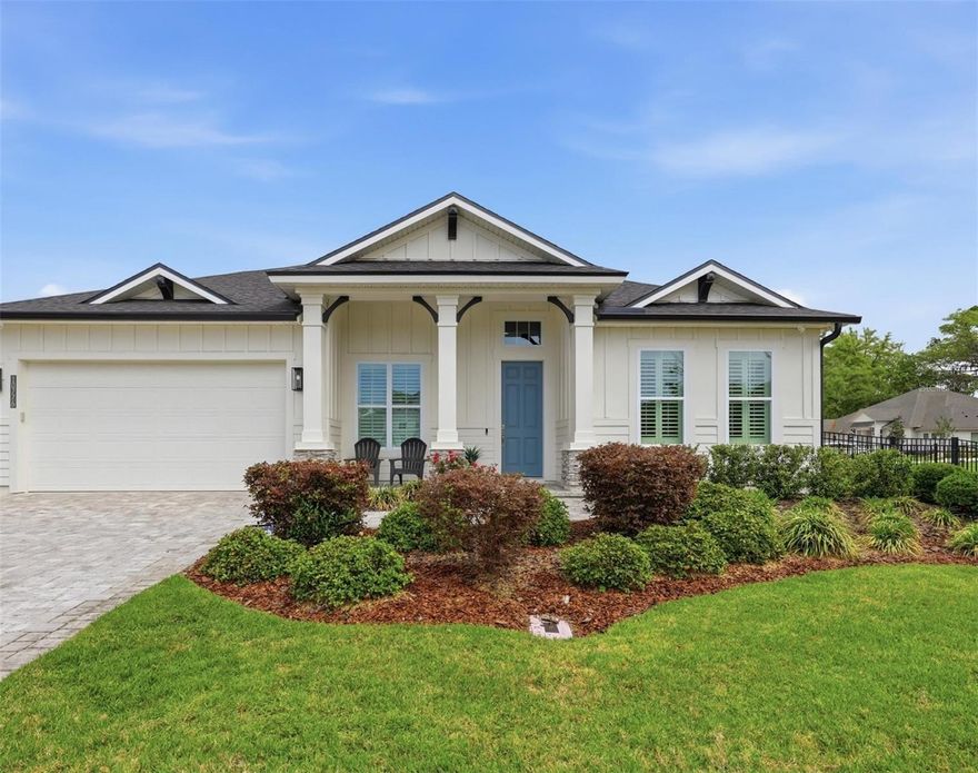 From the moment you arrive, there’s an immediate sense that this home is different. It’s not just the space or the upgrades, it’s the way everything comes together to feel welcoming, elevated, and truly move-in ready. Set on a rare oversized corner lot, just under 1/3 of an acre, this property offers a sense of space and privacy that is increasingly hard to find. It lives like new construction, but with more land, abundant upgrades, and a level of completeness that allows you to move in and immediately enjoy. Inside, the layout strikes a perfect balance between comfort and functionality. With 3 bedrooms, 3 bathrooms, plus a dedicated study and a versatile bonus room, the home adapts beautifully to the way you live. The split floor plan creates separation where you want it, while the open concept design encourages connection in the main living spaces. Extra high ceilings and plentiful natural light enhance the sense of openness, giving each room a bright and welcoming feel. At the center of it all, the kitchen is designed to bring people together. The oversized quartz island anchors the space, complemented by a farmhouse sink, Viking gas cooktop, double ovens, and a generous walk-in pantry. Just beyond, the dining room is ready for everything from holidays to intimate evenings, creating a natural extension of the home’s entertaining flow. Adjacent to the kitchen and walk-in pantry is a well placed drop zone, which adds an extra layer of ease, keeping everyday life organized without effort. The primary suite offers a true retreat at the end of the day, with a roomy walk-in closet, a spacious shower, dual sinks, dedicated vanity space, and a private water closet. Touches like a tankless water heater add comfort and efficiency in ways that matter over time. Throughout the living areas and bedrooms, luxury vinyl plank flooring provides both durability and a clean, cohesive aesthetic. Just beyond the living space, the nesting sliding doors, which blur the line between indoor and outdoor spaces, allow the Florida lifestyle to shine. The screened paver patio, plumbed for a gas grill, creates a comfortable, shaded space to unwind, while the extended uncovered patio opens up even more possibilities, perfect for outdoor dining, weekend grilling, or simply enjoying the sun. The landscaped and fully fenced yard offers plenty of room for a future pool, making it easy to bring your vision of paradise to life. Practical features are just as seamlessly incorporated, including a 3 car garage wired for an EV charger, whole-house surge protector, wiring for cameras, a paver driveway, and upgraded, move-in ready finishes throughout. Every detail contributes to a home that feels both grand and easy to live in. Beyond the home itself, life in one of Gainesville’s most desirable neighborhoods, Oakmont,  offers something truly unique. Residents enjoy access to a beautifully designed clubhouse, a fully equipped fitness center, tennis and pickleball courts, and an oversized resort-style pool with a separate splash area. Walking paths, playgrounds, and expansive green spaces surrounded by protected natural areas create a setting that feels both active and serene. All of this, just minutes from Tioga Town Center and Haile Village Center, with convenient access to golf, dining, medical facilities, and everyday essentials. Beyond its features, this home delivers a lifestyle that is effortless, sophisticated, and hard to replicate.