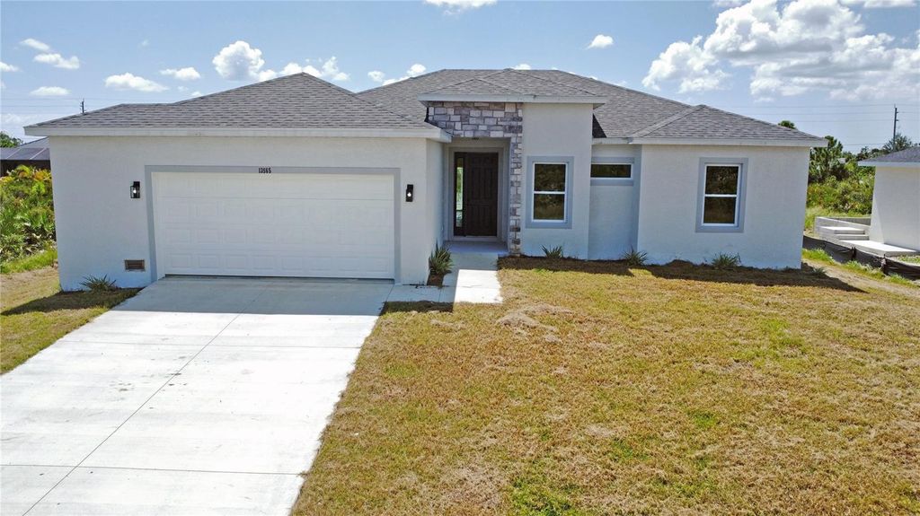 Photo of 13558 Jeronimo Lane, Port Charlotte, FL 33981 (MLS # O6407630)