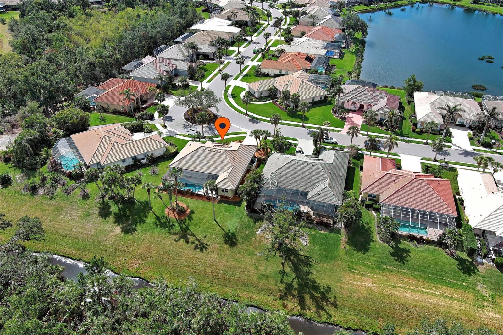 If you love peace and quiet and want to live in the highly sought after, gated and golfing (golfing optional) Sawgrass community, then this is the home of your dreams. Ideally situated on a rare, over-sized lot (over 9,000 feet), this exceptional home affords maximum tranquility and offers 2,178 feet of luxurious living space with 3 generously sized bedrooms + office (could be a dining room), 2 bathrooms and 2 car garage. Over $96,000 in recent upgrades and truly move in ready, the sellers had a home inspection and have completed all repairs - just move right in and live life to the fullest. Wrap up a day in paradise savoring the tranquil water and preserve view, birdwatching or floating in the large, heated pool, listening to the soothing waterfall feature - your own private oasis. Lived in only seasonally, you will appreciate the breathtaking views, the ultimate privacy, the soaring 12-foot ceilings, the classy crown molding and how airy and bright the home is, thanks to the wall of glass sliders and many windows. The gourmet kitchen was just beautifully remodeled with stunning quartz countertops, making the heart of the home a chef's dream and features newer stainless-steel appliances, wood cabinets, a large breakfast bar, sunny breakfast nook and pantry. Drift off to sleep in the spacious primary suite, a true retreat, which offers his and her walk-in closets, a cozy sitting area, easy lanai access and an ensuite bathroom with dual sinks, Roman shower, garden tub and water closet. The split floor plan and guest suite ensures guests have plenty of privacy and the roomy office is light and bright. No need to wait to build: the recent upgrade list includes new kitchen quartz countertops, a new tile roof (4 years young), complete pool and pool deck resurfacing, lanai refurbished, and the pool pump and heater are newer (2021 & 2022) - no work to do. On a practical note: newer AC (2019), water heater (2023), there is a water softener system and security system, and the separate laundry room has many storage cabinets. This immaculate home has wonderful curb appeal thanks to lush landscaping, welcoming entryway and double glass doors. Sawgrass is a friendly, active community with a secure, manned gate guard with mature landscaping, set upon 54 acres of lakes and preserves with 9 holes of a public golf course meandering through it. Ride in your golf cart to socialize in the clubhouse, make friends by the large resort style, heated pool and get toned on the pickleball courts or in the fitness facility. More to appreciate: No CDD fee, low HOA fee and home is not in a flood zone. Ideal location: only 4 quick miles to Venice Island with its delicious dining, fun shopping and many cultural events and close to all the conveniences you could ever want. Schedule your private tour today and come make this incredible home yours! Be sure check out the video.