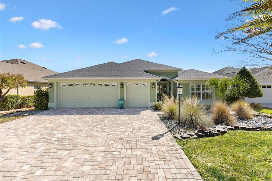 Welcome to this beautifully appointed 3/2 Iris Designer Home located in the desirable The Village of Buttonwood near the end of the street quiet cul de sac. Major updates provide peace of mind with a roof replaced in 2021 and HVAC installed in 2010.
Close to Fish Hawk Recreation Center, Redfish Run and Tarpon Boil Executive Golf Courses, Cane Garden Country Club is just 5 minutes away for fine dining and 3 championship golf courses. You’ll be between Lake Sumter Landing and Brownwood Paddock Square for dining, entertainment, and shopping.
A paver driveway and walkway lead to the impressive entry featuring a stained glass front door with matching stained glass side panels and a transom window, allowing natural light to fill the foyer. Inside, you’ll find a coat closet and an open, split floor plan enhanced by tile floors throughout, ceiling fans with light kits, crown molding, and plantation shutters for a refined finish.
The guest wing is privately located off the foyer behind a pocket door, offering two comfortable guest bedrooms that share an updated bath featuring a walk-in shower with bench and a solar tube for added natural light.
The spacious kitchen is designed for both function and style with stainless steel appliances, pull-out cabinet shelves, and a pantry closet with pull-out shelving. A breakfast bar with pendant lighting provides additional seating, while the dining nook offers direct access to the lanai—perfect for casual meals and entertaining.
The master suite is a relaxing retreat featuring a tray ceiling and a large custom walk-in closet, ensuite bath includes a split dual vanity, vanity makeup table, Roman walk-in shower with bench, water closet with bidet, and a window for natural light.
Outdoor living is equally impressive. The lanai opens to a spacious birdcage enclosure complete with a built-in spa, an outdoor +paver patio with firepit, creating the perfect setting for relaxing or entertaining. Additional conveniences include custom closets throughout, a private sauna, an extra refrigerator and a whole-house water filtration system.
This exceptional home combines elegance, comfort, and resort-style outdoor living in one of the most sought-after areas of The Villages. Make your appointment to see it today so you can start living The Villages dream.