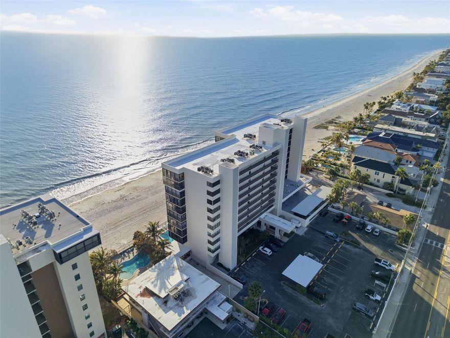 Wake up to the beauty of the Gulf in this stunning direct beachfront 2-bedroom, 2-bath condominium offering approximately 1,100 square feet of coastal comfort, breathtaking views, and the soothing sound of waves just beyond your balcony. Perfectly positioned directly on the shores of Madeira Beach, this Gulf-front residence delivers the kind of lifestyle buyers dream about — where the beach feels like your backyard and every day ends with a spectacular sunset.

Inside, the condo is bright, welcoming, and thoughtfully designed to maximize the view. The living space flows seamlessly to a spacious screened balcony that extends across both the living room and the primary bedroom, creating an effortless indoor-outdoor connection and a front-row seat to the Gulf and horizon. Premium luxury vinyl flooring adds a stylish, upscale touch, while the in-unit washer and dryer provide everyday convenience. Both bedrooms feature their own en-suite bathrooms, offering comfort and privacy, and the primary suite is especially inviting with direct balcony access and beautiful Gulf views from the moment you wake up.

Beyond the residence itself, the community enhances the beachfront lifestyle with desirable amenities including a pool, hot tub, clubhouse, and fitness center — all designed to make everyday living feel more like a getaway. The condo fees also include several valuable essentials, such as cable TV, internet, water, flood insurance, and more, adding convenience and helping to simplify ownership.

Whether you are searching for a full-time beachfront residence, a seasonal retreat, or a property with income-producing potential, this condo offers exceptional flexibility. Enjoy it for part of the year and rent it during the months you are away to help offset ownership costs. Ideally located near the dining, shopping, and entertainment of John’s Pass, while still offering the peace and beauty of true beachfront living, this is more than a condo — it is your opportunity to own your own piece of paradise on Madeira Beach.