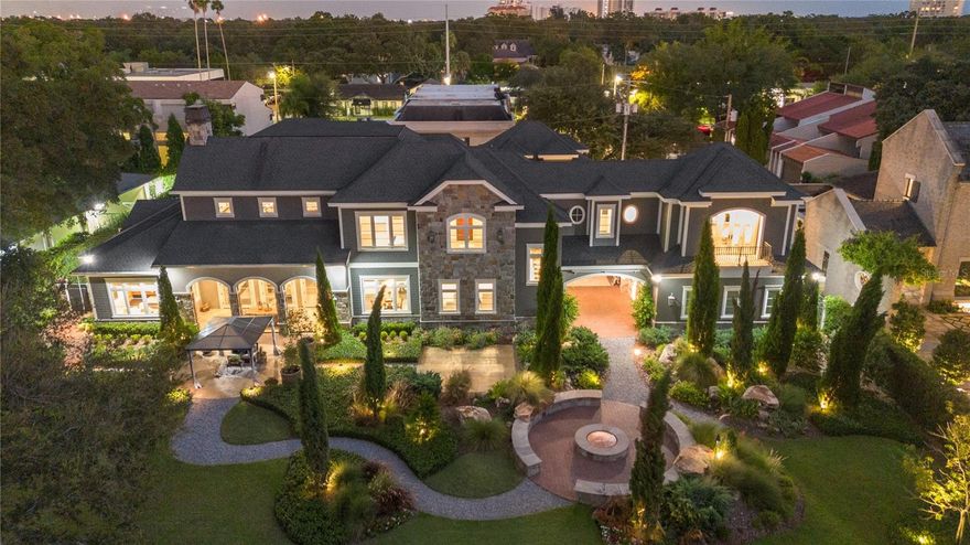 Exceptional in every feature, this magnificent, custom estate positioned on the 1st hole of the notable Palma Ceia Golf Course, showcases superb craftsmanship, state-of-the-art technology, picturesque settings, and fabulous amenities. This impressive residence, built in 2018 by RSB Construction, offers sophisticated entertaining spaces throughout.  Making it the perfect home for informal gatherings or large events.  Situated on 1/2 an acre, the European, inspired gardens offer an enchanting setting. Enjoy cool fall evenings, around the oversized stone fire-pit.  Watch the sun set over the golf course under the pergola.  Or set up a dance floor on the pavered multipurpose area.  The thoughtful, landscape plan includes paths joining the spaces leading to a stunning arched porte-cochere transitioning to the front of the home.  The stately entrance features an electronic gate and brick pavered courtyard with a 4-car garage.  Approach the cobblestone archway leading to the grand, arched, double doors. The meticulous craftsmanship is apparent upon entry.  And while the expansive ceiling heights and room sizes evoke impressions of grandeur, the home, still imparts a feeling of warmth and comfort.  The formal great room features 14 feet ceilings with elegant, coffered millwork, a stately, wood burning fireplace, and ample space for both dining and living.  Open the three sets of French doors and dine al fresco on the covered lanai.  Or raise the retractable screens and extend your enjoyment into the garden.  Leading to the kitchen is a gorgeous, brick barreled archway, another exceptional detail that sets this jewel apart.  The kitchen features wood beamed ceilings, marble counters, custom cabinetry, professional grade Capital Connoisseurian 48” gas range, 30” Subzero column fridge and freezer, 24” Subzero wine cooler and warming drawer.  The adjacent breakfast nook provides the perfect setting to enjoy family meals.  There are also two walk in pantries, a small den, downstairs laundry, a drop zone and back staircase.  Across from the great room, the family room is ideal for game watching parties.  With a full wet bar with Scotsman icemaker and a wall of sliders opening to the screened pool lanai, it is the epitome of indoor/outdoor living.   Watch one of three TVs in the extended space or use the large retractable screen by the saltwater pool. The outdoor kitchen features an oversized TEC Infrared grill, XL Big Green Egg, and more.  Back inside, follow the arched hallway to the primary retreat.  Resplendent with vaulted ceilings, an abundance of natural light and views of the garden, the large bedroom and sitting area create a true sanctuary.  The primary bath is elegant and timeless with marble floors, tile and counters.  Both closets are also generous in scope and size.  Completing the first level is a private study.  Upstairs, there is a sizable bonus room, private library and expansive laundry room.  All three secondary bedrooms offer walk-in closets and attached baths.  Beyond the other bedrooms, find an impressive, secluded guest wing. There is also a fabulous one-bedroom apartment above the garage with a kitchenette, living room, bedroom, and full bath.  The home features a Generac generator, impact rated windows and doors, and Control4 smart system to manage lighting, security, temperature, media and surround sound throughout.  This gorgeous estate will be featured on HGTV as an inspiration home in 2024, but you can see it in person!