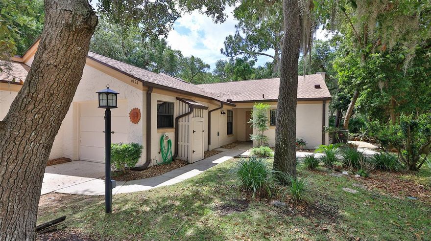 Well maintained 2. bedroom 2 bath duplex located on a private cut-de-sac in Riverwood Plantation.  Just minutes to the beach, shopping, dining with wonderful community amenities including a clubhouse, pool, tennis, pickle ball, fishing pier and private boat launch on Spruce Creek River.  Brand new Roof (3/2026) hot water heater and Central air and heat replaced in 2022.  Exterior freshly painted and all trim including new gutters with leaf guards.  Large Living / Dining Room with vaulted ceiling and large wood burning fireplace.  Master Bedroom with private bath, walk in closet.
Inside Laundry Room, Nicely appointed kitchen with private side entry to side patio. Enclosed Florida room off the Living area creates extra space for relaxing and enjoying the wonderful landscape.  Located in one of Volusia counties sought after school zones.   Bring your personal touches and make this a perfect place to call home.