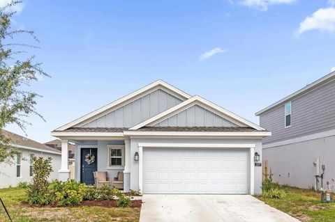 Photo of 509 Sea Turtle Lane, Haines City, FL 33844 (MLS # O6381266)