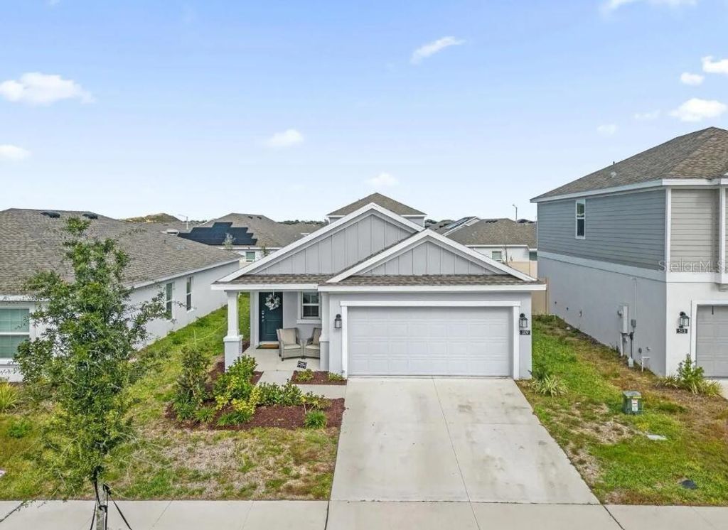 Photo of 509 Sea Turtle Lane, Haines City, FL 33844 (MLS # O6381266)