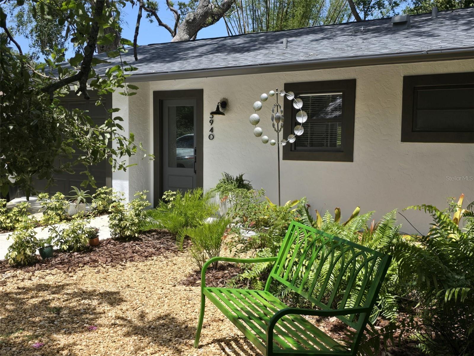 Vacation rental: An exquisite jewel under a canopy of majestic oaks, with every corner rebuilt, mixing both contemporary and charming elements. Two large exceptional bedrooms, 1 King, 1 Queen and 1 Twin beds, sleeps 5. Wall of closets, two brand new modern baths, and equally gorgeous kitchen fully equipped with brand new appliances, ceiling fans in every room, central air, white beamed ceilings, windows everywhere, designer lighting and fixtures, plus an immense deck overlooking a huge naturally forested backyard, featuring swaying bamboos, fruit laden mango tree and ferns. An absolutely private setting, surrounded by the privacy of high modern slatted fencing.
This gem in a fantastic location, is a unique neighborhood dotted from tiny Victorians to luxury homes. So convenient - 7 minutes to everywhere. Whether for vacation or business to enjoy the proximity of the magnificent Sarasota downtown, explore the white sand beaches of famous Siesta Key, Lido Key, nearby galore of stores, restaurants, markets, hospitals, cultural sites, but also a peaceful place to call home away from home. Offered tastefully furnished to Better Home and Gardens standards. For your comfort there's high speed WiFi, brand new LG laundry tower and private off street parking. Small, well behaved dog acceptable with prior owner approval and pet fee. No smoking. Available now! June - Nov $3,250 monthly - $1,700 weekly. Dec $4,000, Jan - Apr $,5,800. No smoking. Pets permitted with prior owner approval and pet fee.
