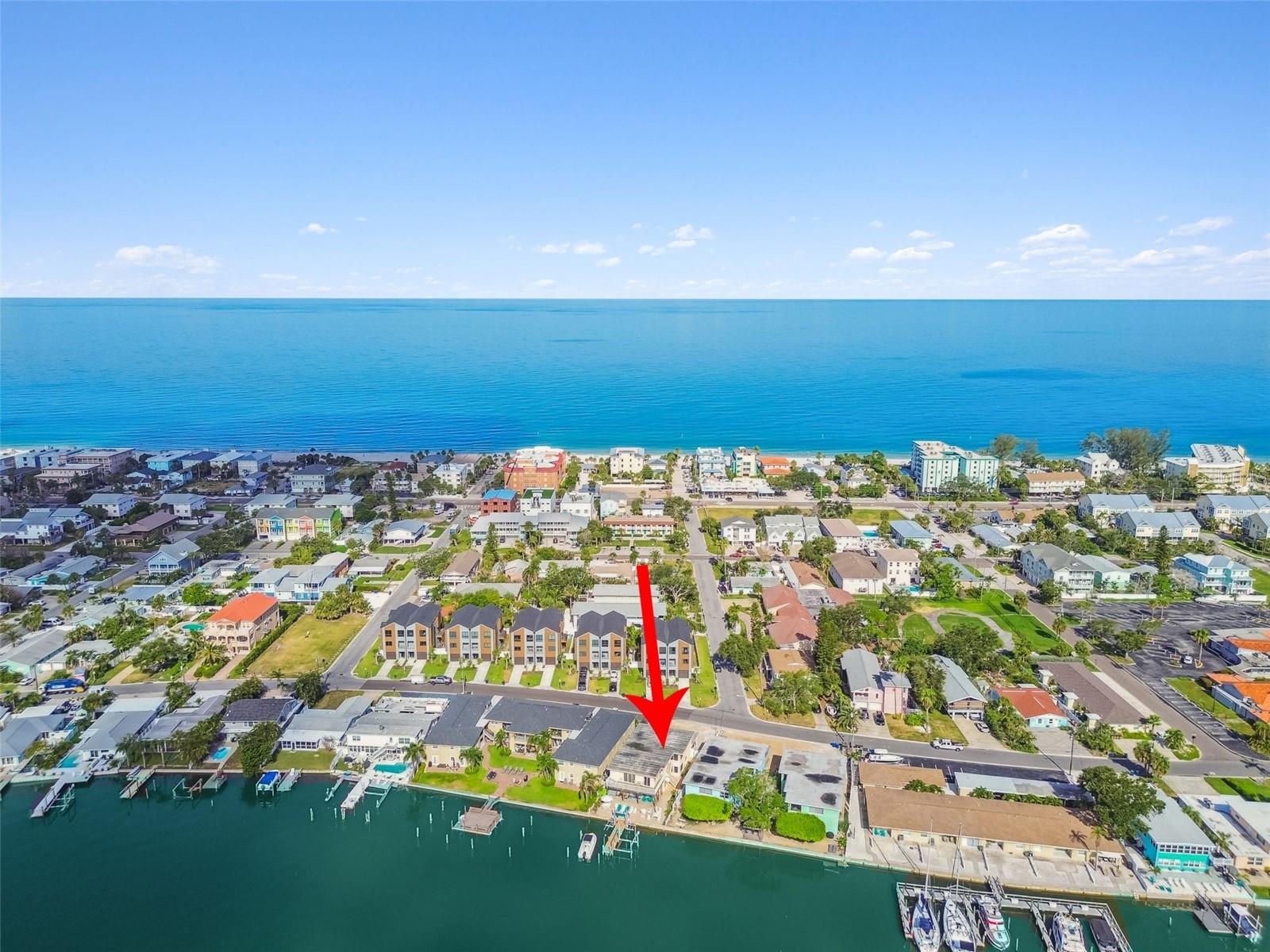This turnkey, fully furnished waterfront fourplex in Indian Rocks Beach offers an exceptional investment opportunity with four bright and spacious 2-bedroom, 2-bathroom units, all approved for short-term (daily) rentals. Each unit comfortably sleeps up to six guests and features two king beds along with a queen sleeper sofa or murphy bed, creating a combined capacity of 24 across the property. Inside, guests will appreciate the coastal-inspired décor, open layouts, and fully equipped kitchens that make extended stays easy and enjoyable. Outdoors, guests can take advantage of a deep-water dock that accommodates boats up to 40 feet and enjoy paddle boarding, kayaking, or fishing right from the property. The beach is just a short stroll away for waves, sunbathing and shelling. Popular restaurants highlighting the local seafood are close by as are attractions like mini golf and a water park. Guests will also enjoy the ease of a 25 minute ride from St Pete - Clearwater International Airport and proximity to museums, professional sports arenas and theme parks.
The two ground-floor units have been thoughtfully renovated with flood-resilient construction in mind. In the event of future flooding, the wall panels are easily removable and all electrical wiring is UF-B waterproof-rated. Premium solid wood was used throughout—including cabinets, doors, and trim—ensuring long-term durability. This level of construction not only adds a layer of hurricane resilience but also reduces future maintenance and tenant-related wear and tear. The bottom two units also feature brand-new A/C systems and the building offers impact windows throughout and a newly refreshed seawall, offering peace of mind and energy efficiency. Ample on-site parking and shared access to a convenient laundry room adds to the convenience for both owners and guests. This fourplex is truly a rare blend of income potential, prime location, thoughtful design, and resiliency—perfect for investors looking to capitalize on one of Florida’s most sought-after beach destinations.