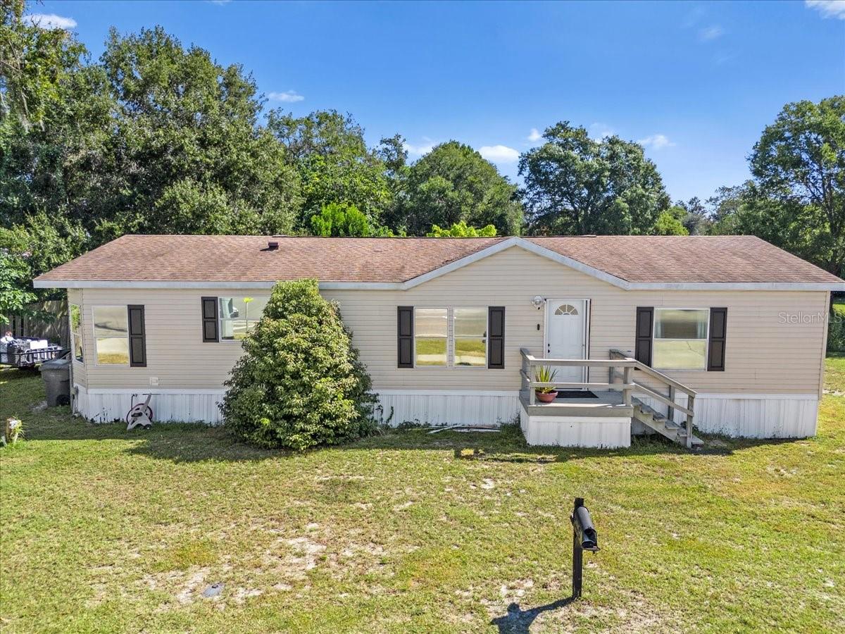 **No HOA, no restrictions — just your home, your rules, your lifestyle. Welcome to your Auburndale retreat! This beautifully maintained 3-bedroom, 2-bath 2021 mobile home offers the perfect blend of comfort, style, and freedom — with NO HOA and your own private lot! Enjoy the peace of mind that comes with owning your land, giving you the freedom to personalize, park your toys, or create the outdoor space you’ve always dreamed of. Inside, you’ll love the open floor plan featuring modern vinyl flooring throughout and a bright, updated kitchen with white cabinetry, sleek countertops, and a stylish tile backsplash. The spacious dining area flows seamlessly for easy entertaining and everyday living. Your primary suite is a true escape offering plenty of space to unwind, a luxurious bathroom with a relaxing garden tub, stand-up shower, and dual sinks for convenience. Located just minutes from Walmart, Publix, shopping centers, and I-4, this home offers both tranquility and accessibility. CALL FOR A TOUR TODAY!!