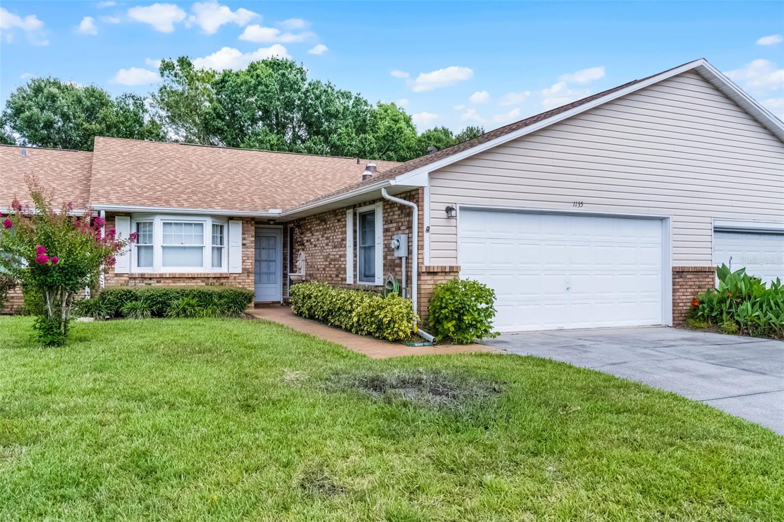 Welcome to this charming townhome nestled in the Palamar Oaks Village community with 3 spacious bedrooms, 2 full bathrooms, and a private driveway to the attached 2-car garage. Step inside to the open floor plan, with ceramic tile flowing throughout the home. The large kitchen is equipped with all new SS appliances, plenty of cabinetry and counter space, and breakfast bar overlooking the dining room. Owners can escape to their primary bedroom suite, featuring a walk-in closet and an attached ensuite bathroom. The split floor plan offers extra privacy, with two additional bedrooms with built-in closets. French doors off the living area open to a screen-enclosed rear porch/lanai—ideal for indoor/outdoor flow of entertainment & enjoying peaceful Florida evenings. The attached, 2-car garage leads to the convenient mudroom space adjoining the garage and kitchen with inside laundry hookups—great for pantry overflow or pet needs. This community is surrounded by mature trees and boasts a clubhouse, community pool and includes ground maintenance. Centrally located in St. Cloud, just minutes from U.S. 192, healthcare facilities, shopping, dining and entertainment. Quick access to the Orlando area makes it ideal for commuters or those seeking urban amenities while enjoying suburban charm. With its move-in-ready condition, modern updates, and smart layout, this home combines affordable comfort with practical convenience. The combination of the newer roof, AC, updated finishes, and strong community setting makes it ideal for first-time buyers, families, or investors alike. Don’t wait - Schedule a showing today!