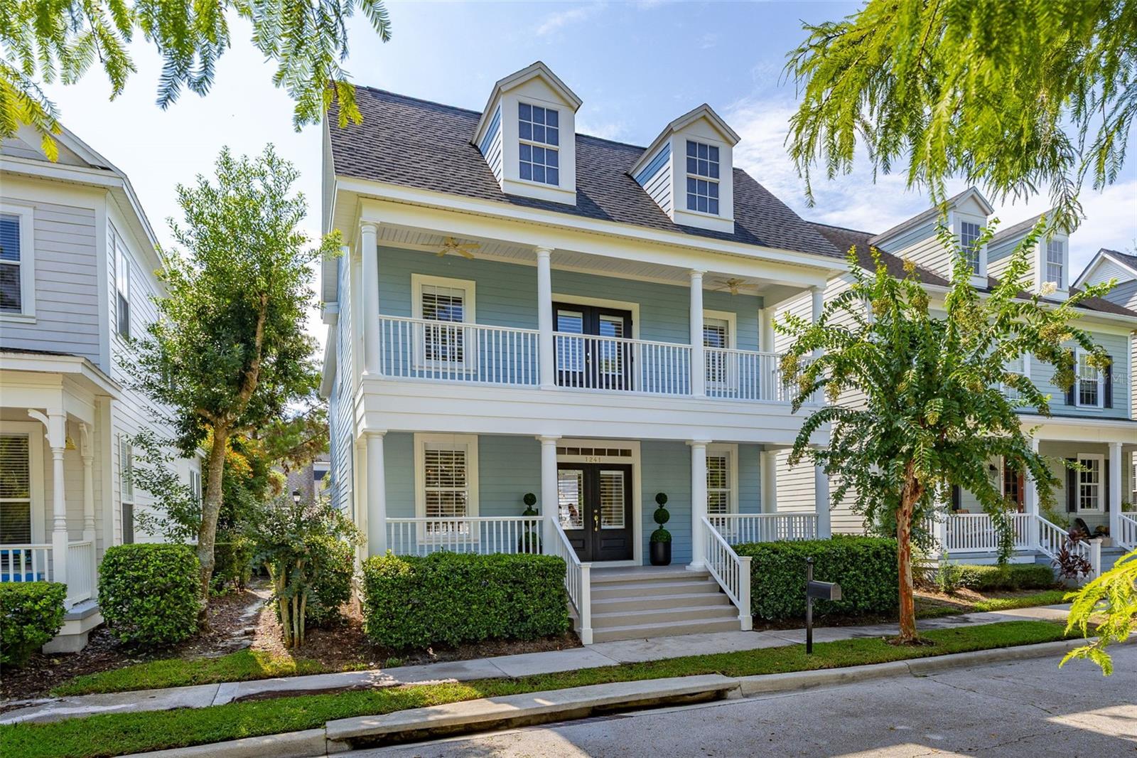 Welcome to 1241 Golden Canna Lane, a fantastic home right in the heart of Celebration, FL, located in the desirable Aquila Reserve area. This property offers a perfect blend of style and comfort with 2,077 square feet of living space. With three roomy bedrooms and two and a half bathrooms, it’s just the right fit for anyone looking to settle in a friendly neighborhood. Step inside and you’ll notice the inviting open-concept layout. The large windows let in tons of natural light, making the place feel even more spacious. Since March 2025, some great updates have been made, including new GE Cafe appliances, fresh paint both inside and outside, garage epoxy floors and custom Norman Plantation Shutters along with Zebra blinds for that added touch of privacy and flair. The roof was replaced in 2022, HVAC in 2018 and high efficiency hybrid hot water heater in 2025. The kitchen is a cook’s dream, featuring a breakfast bar, sleek granite countertops, and top-notch stainless steel appliances like a french door double oven and 6 burner gas stove. Whether you’re whipping up a quick breakfast or hosting a dinner party, this kitchen has got you covered. Right next to it, the gathering room is perfect for hanging out, complete with a Samsung Frame TV. The primary suite is your own private escape, featuring a spa-like bathroom with modern amenities and a custom closet for all your storage needs. The secondary bedrooms are cozy and bright, with engineered hardwood floors that add a warm touch. Step outside to the backyard and you’ll find a private patio and courtyard that are perfect for barbecues or just relaxing under the stars. The built-in barbecue makes outdoor cooking a breeze, and the permeable paving is a thoughtful touch for eco-friendly living. Plus, the attached garage comes with extra storage space. The home is equipped with modern conveniences like smart lights, and smart thermostat, ensuring your comfort and peace of mind. If you're looking for a comfortable, stylish place to call home in one of Florida’s most charming communities, 1241 Golden Canna Lane is the perfect choice. This home is close to Downtown Celebration and Walt Disney World property. Come see for yourself and experience all it has to offer!