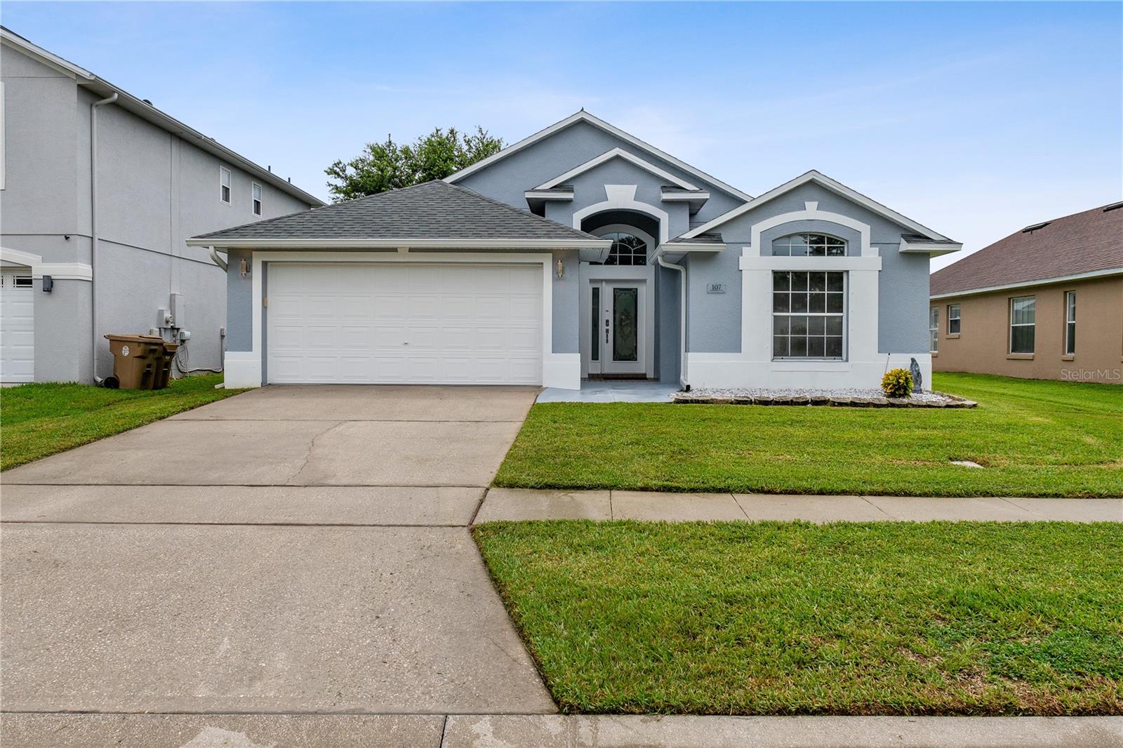 Welcome to your dream home in serene Kissimmee! After admiring the meticulously manicured landscaping kept green and vibrant year round with a sophisticated sprinkler system, step through the picturesque glass front door, secured with a high-tech Yale smart lock, and kick up your feet in this nearly 1800-square foot stunner. This spacious open floor plan boasts upgrades and technology throughout. Sleep soundly with the recently-installed Blink electric doorbell, an ungraded ADT security system, and smart lighting. The newly-installed air conditioner, Nest 3 thermostat, and Rheem Performance Platinum WiFi water will have you so comfortable you’ll never want to leave. While you’re relaxing, cook up something in your new gourmet kitchen. State of the art LG and Samsung appliances, beautiful granite countertops, professional 42-inch cabinets, and a large stainless steel deep sink will make both cooking for one and entertaining a crowd a breeze! Soak up the sun with a large, luxurious enclosed outdoor living space — or enjoy all that Florida living has to offer with the community’s golf course and clubhouse amenities. What are you waiting for? Snag this gorgeous upgraded 3/2 before someone else does! 8k in Epoxy upgrades to the floors of the sun room and garage in June 2025.