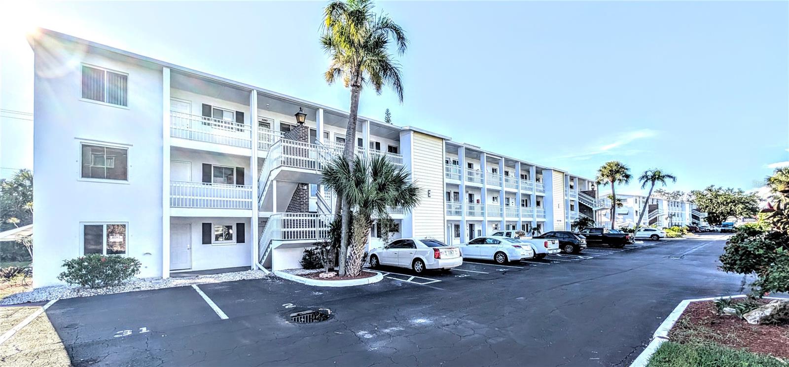 Exceptional ground floor end unit in the popular 55+ Community of Bayshore Gardens Condominium. The kitchen upgrades include maple cabinets, granite countertops, and plenty of storage for all your kitchen gadgets. All the floors have ceramic tile so you don't have to worry about cleaning the carpets. The patio is completely enclosed and just outside the door you will find a spacious backyard with a gate that leads straight to the Winn Dixie Grocery Store. The amenities here are very nice with a heated pool, shuffleboard, and a very active clubhouse where you can enjoy socializing with your neighbors and friends. There is plenty of shopping just across the street where you will find a Publix Grocery Store, Target, T.J. Maxx and several small restaurants and shops. If you are wanting to relax at one our Beautiful West Coast Beaches, you have a few options including Siesta Beach and Anna Maria Island.