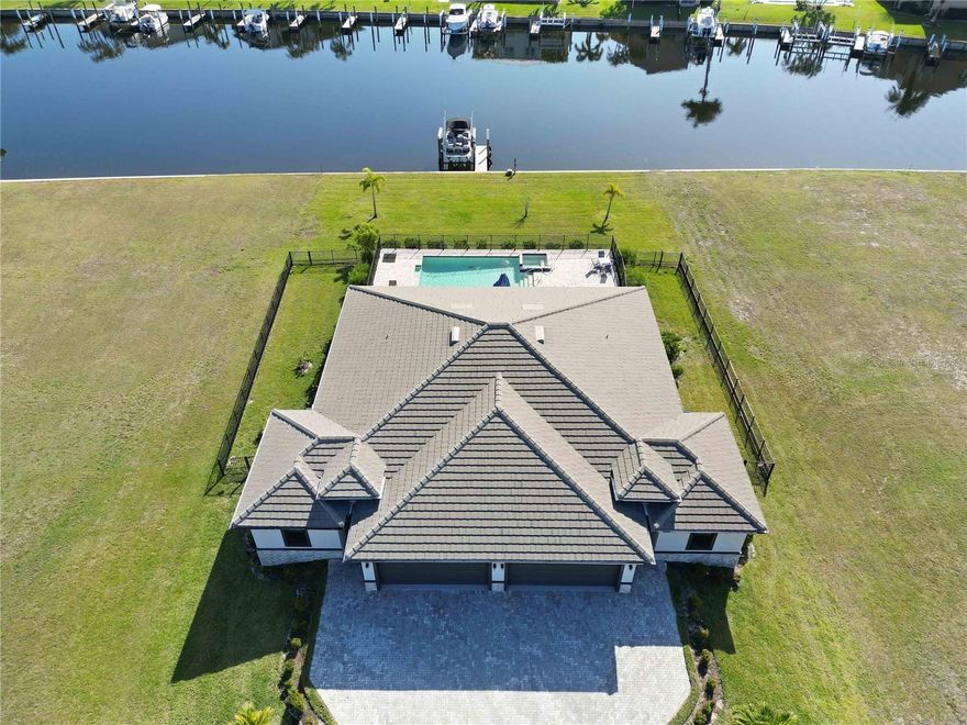 Welcome to 3240 Wood Thrush Drive, an exceptional waterfront investment opportunity in the highly desirable Punta Gorda Isles. Built in 2022, this custom luxury sailboat waterfront duplex offers modern construction, premium amenities, and strong income potential in one of Southwest Florida’s most established boating communities. Weekly and nightly rentals are allowed, creating a rare opportunity for investors seeking immediate rental income while owning a newer luxury property in a prime location.

This fully furnished duplex features two spacious residences, each offering three bedrooms and two bathrooms with a two car garage, creating an ideal setup for investors who want flexibility for vacation rentals, multigenerational living, or owner occupancy with income from the second residence. The interiors showcase luxury vinyl plank flooring throughout, premium granite countertops, recessed lighting, and a thoughtful layout designed for both comfort and durability. Each unit includes a screened front porch and private lanai, providing multiple areas to enjoy the Florida lifestyle.

The outdoor living area was designed for relaxation and entertainment. The property features a heated pool with a built in spa surrounded by an expansive brick paver pool deck and driveway. Accessibility features include walker and wheelchair friendly areas within part of the home along with a pool chair lift for ease of entry. A Halo whole home water system and mosquito misting system provide additional comfort and convenience. The property is fully fenced and includes a dedicated dog run, making it ideal for pet owners and guests traveling with pets.

Situated along a wide sailboat canal, the property includes over one hundred feet of seawall and a private dock with a ten thousand pound boat lift. Boaters will appreciate the quick and easy access from the canal to the Peace River, the open waters of Charlotte Harbor, and the Gulf of Mexico with no fixed bridges. From your dock you can cruise to some of the region’s most popular waterfront destinations including Fishermen's Village, Boca Grande Pass, Cabbage Key, and the surrounding barrier island beaches. 

The location places residents close to everything Punta Gorda has to offer. Students are served by Sallie Jones Elementary School, Punta Gorda Middle School, and Charlotte High School. Healthcare is conveniently available at Bayfront Health Punta Gorda and ShorePoint Health Port Charlotte. Outdoor enthusiasts will enjoy nearby parks including Ponce de Leon Park and Gilchrist Park along with the dog friendly areas at South County Regional Park Dog Park.

Daily conveniences are minutes away including Publix Super Market at Punta Gorda Isles along with additional shopping and dining throughout the Punta Gorda area. The property also offers easy access to major transportation corridors including Interstate 75 and U.S. Route 41. Air travel is convenient with Punta Gorda Airport located only minutes away and Southwest Florida International Airport within comfortable driving distance.

For investors seeking a luxury waterfront property that combines new construction, boating access, resort style amenities, and short term rental flexibility, 3240 Wood Thrush Drive represents a rare opportunity to acquire a turnkey income producing asset in one of Southwest Florida’s most desirable waterfront communities.