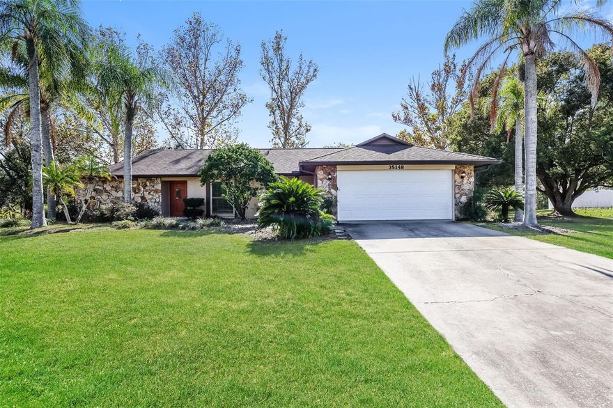 Charm and curb appeal abound for this Zephyrhills home! Step inside into the inviting foyer, past the family room, and into the well-appointed living room, which features a fireplace. The kitchen boasts stainless steel appliances, hard surface countertops, and ample storage. This split, ranch-style floorplan offers a primary suite and two secondary bedrooms. Enjoy your screened patio all year long! Come and see for yourself the possibilities that this home has to offer!