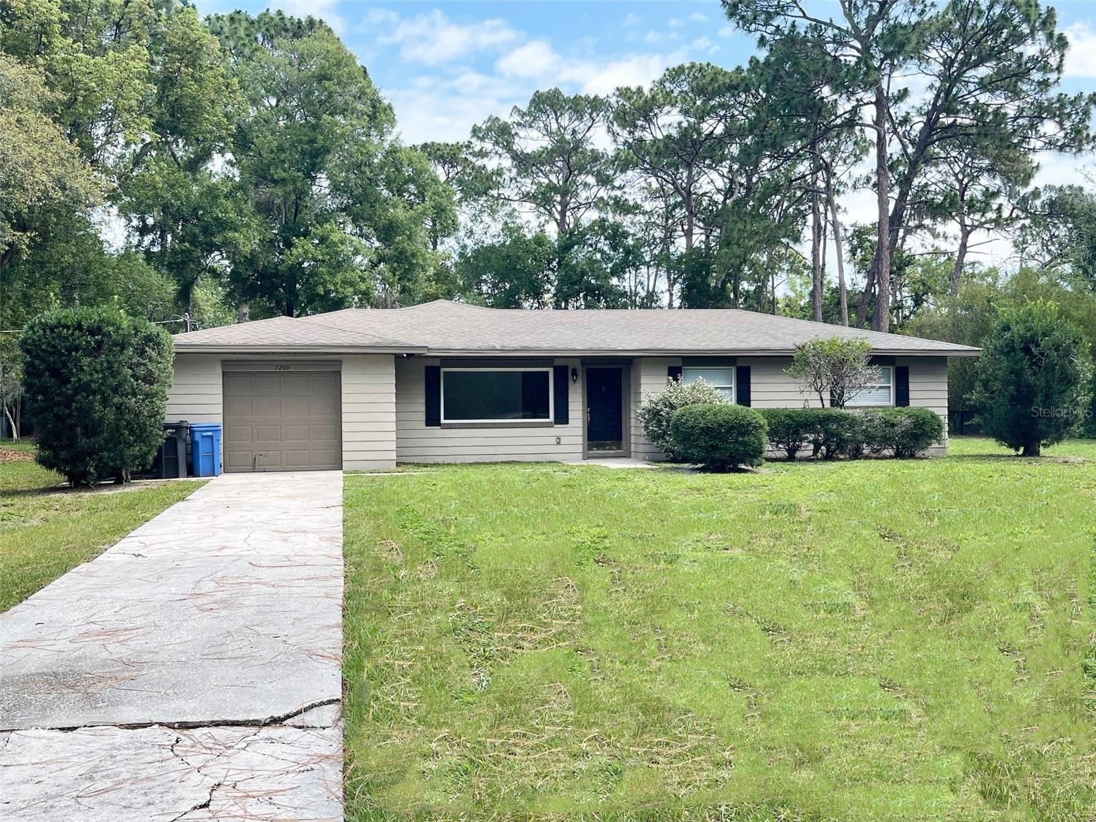 Enjoy peace, privacy, and space on nearly an acre in the tranquil community of Cypress Lake Estates. This charming 2-bedroom, 2-bath single-family home offers 1,366 square feet of comfortable living space and sits on an expansive 0.82-acre lot with 148 feet of frontage. Updated with modern features, the home includes a finished screened porch, central HVAC, and a one-car garage. Inside, you'll find a spacious layout with a bright living area, a functional kitchen, and two full bathrooms. The property’s oversized lot provides ample room for outdoor enjoyment, whether it’s gardening, entertaining, or simply enjoying the quiet surroundings. Located in a top-rated school district in Hillsborough County and just a short drive to Tampa, this home offers the best of both worlds—country serenity with city convenience. Lawn maintenance included. Available for immediate occupancy. No pets.