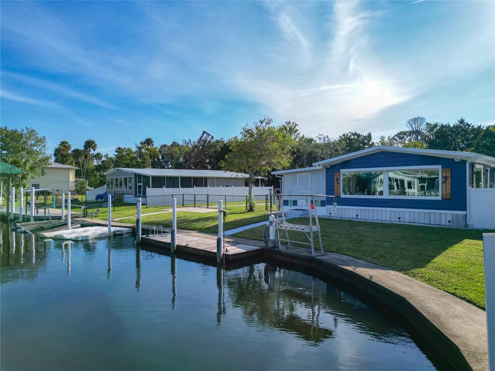 Exquisite Waterfront Retreat in Montezuma Waters. Experience the ultimate in waterfront living with this beautifully remodeled 3-bedroom, 2-bath residence that blends refined coastal elegance with everyday comfort. Situated on a deep-water canal with direct access to the Crystal River, this home offers a rare combination of style, function, and location—and can be rented short-term for excellent income potential. Step inside to discover tastefully curated coastal finishes throughout. The private master suite serves as a serene escape, complete with an indulgent clawfoot garden tub, separate shower, and thoughtfully designed layout. The custom kitchen island is the centerpiece for both casual dining and family game nights, while the living room’s automatic blinds bring both convenience and sophistication. Outdoors, the covered and screened porch sets the stage for unforgettable hangouts, lively parties, or peaceful afternoons overlooking the water. Enjoy two private docks, perfect for launching your boat or simply savoring sunsets over the water. The adjoining lot—included in the sale—features an RV pad, providing ample space for guests or future expansion. Located just minutes from the county boat ramp and Fort Island Beach, this home offers seamless access to world-class boating, fishing, scalloping, and the renowned Crystal River springs. Whether as a year-round residence, exclusive getaway, or short-term rental investment, this property embodies the best of Florida’s waterfront lifestyle.