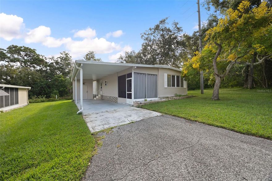 One or more photo(s) has been virtually staged. Welcome to 70 Live Oak Court, a charming 2-bedroom, 2-bathroom home nestled in the heart of Safety Harbor’s highly desirable 55+ community of Briar Creek. Situated on a peaceful corner lot at the end of a dead end road and backing up to a serene conservation area, this property offers privacy and quiet while being just steps from resort-style amenities. The spacious layout features a large living room, separate dining area, and galley-style kitchen with ample cabinet space for storage. Both bedrooms are generously sized, with the primary suite offering its own private bathroom. Outside, you'll find a large covered carport and a detached storage shed. This property has been lovingly maintained, and furniture and appliances currently in the home could be included with the sale, making it move-in ready. Enjoy the Florida lifestyle with access to a community pool, clubhouse, shuffleboard and fitness courts, and a variety of social activities. With low HOA fees and a fantastic location just minutes from downtown Safety Harbor, shopping, dining, and the waterfront, this is an exceptional opportunity to enjoy living in one of the area’s best kept secrets. Don't miss your chance to make this peaceful retreat your next home!