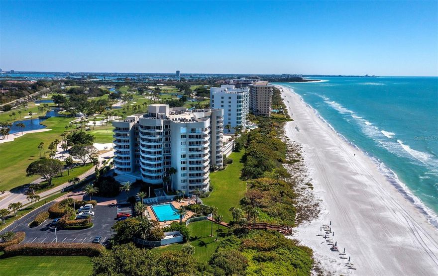 Behind the gates of the Longboat Key Club at Beaches Condo you enter this three bedroom, three bath Gulf front, coastal oasis floorplan that is rarely offered.  Savor expansive beach views and breathtaking sunsets from the glass sliders, windows and spacious terrace. This second-floor end unit unfolds across 2,122 sq ft of well-planned space. The seamless design of the open-concept great room, dining area, and gourmet kitchen creates a haven bathed in natural light, complemented by floor-to-ceiling windows, Italian porcelain flooring, and top-tier appliances. Three generously appointed bedroom suites provide not only comfort but also panoramic Gulf vistas. The master suite stands out with a generous closet and a spa-like bath adorned with premium finishes. Revel in the details of oak wood plank flooring and tasteful designer fixtures and finishes that enhance the residence's aesthetic appeal. Enjoy a life of ease with 24-hour concierge service, direct beach access, a fitness facility, tennis courts and a refreshing pool, among other amenities. Positioned at the south end of Longboat Key, you are only minutes to the renowned St Armands Circle to enjoy shopping, casual and fine dining. A short drive over the John Ringling bridge puts you in the heart of downtown Sarasota offering fine arts and cultural venues and a lively Downtown vibe. This haven promises convenience and leisure at your fingertips. Don't let the opportunity pass to relish beachfront living at its finest. This residence offers spectacular views of the pristine beach, complemented by expansive balconies that beckon you to unwind in the tranquility of the Gulf's embrace