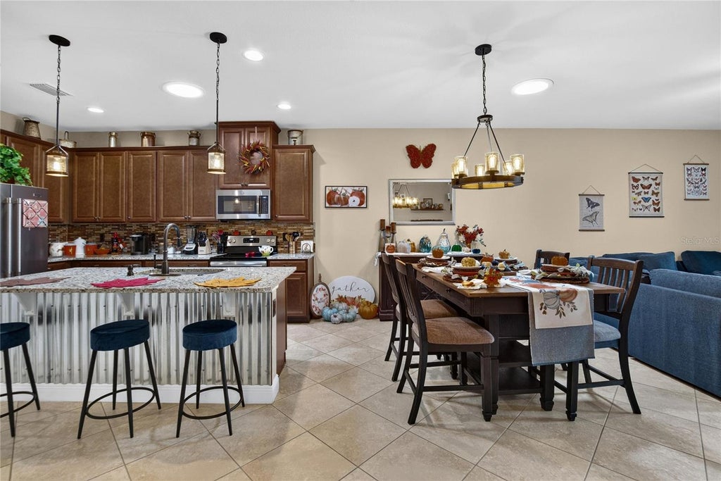 Photo of 10648 Heron Hideaway Loop, Land O Lakes, FL 34638 (MLS # TB8554928)