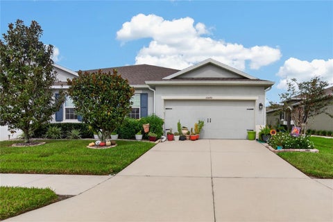 Photo of 10648 Heron Hideaway Loop, Land O Lakes, FL 34638 (MLS # TB8554928)