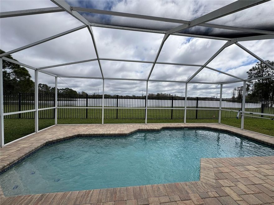 Welcome to this stunning and completely remodeled lake front home located in the desirable West Chase area of Tampa. This home features high ceilings, open space with a huge kitchen, screened in pool and the views from the minute you open the door will make you feel at ease. It's like living on vacation! Huge master suite with soaking tub and walk in shower. Double closets and is the only room on the back side of the house to add to the privacy of a split floorplan. Large living room and open plan with a separate formal dining room plus an extra eat in space in the kitchen. Do not miss your chance to call this place home!