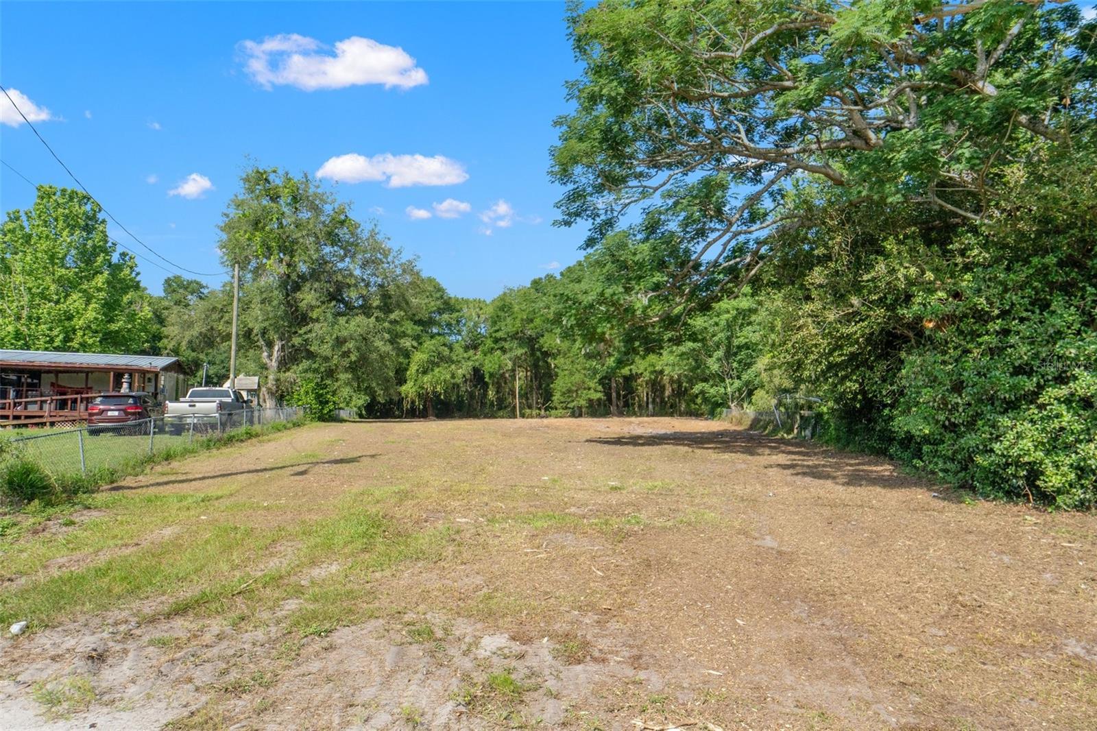 Here is your opportunity to own a spacious .75 acre lot in a quiet, well-established neighborhood. This oversized parcel offers the perfect canvas for your dream home, investment property, or retreat, with plenty of room for a custom build, outdoor living space, pool, and more.
Nestled in a peaceful area yet conveniently located just minutes from downtown Brooksville, shopping, dining, schools, and major roadways, this property combines the best of rural tranquility with everyday convenience. With the land already cleared and public water utility available, you’ll save time and money in the building process—just bring your vision and make it a reality. Whether you’re a builder, investor, or homeowner, this rare find offers flexibility, space, and value in a growing area of Hernando County. Some additional property highlights include No HOA or deed restrictions, paved road access, and quick access to US-41, SR-50, and I-75. Don’t miss your chance to secure this ready-to-go parcel in a sought-after Brooksville location. Schedule your showing or drive by today!