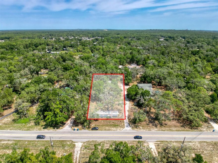 Here's your chance to own a nice sized property that is just under an Acre, where the impact fees have already been paid, electric is already hooked up AND it has a large 40x60 enclosed metal Storage building/Garage/Workshop with electric that will hold multiple vehicles. There is an uninhabitable single wide on the property which is being used for storage and 2 sheds. There is a Well & Septic, however, they are NOT connected and haven't been used in awhile. Zoned AR2, so bring the farm animals and enjoy a piece of country living that is within a few miles of shopping, restaurants, schools and the Suncoast Parkway. Easy access to Tampa, St. Petersburg, Homosassa and Brooksville via the Suncoast Parkway, Cortez Blvd., US 41 or US 19. NO Seller financing. NO sight unseen offers. Cash or Conventional only for this property. DO NOT access property without a real estate agent and an appointment.
*The 6 bedroom, 4 bath quadruple wide with pool next door belongs to a relative, and is also FOR SALE in a separate transaction. The driveway is shared. Buy one or both and the combined property would be 2.5 Acres.