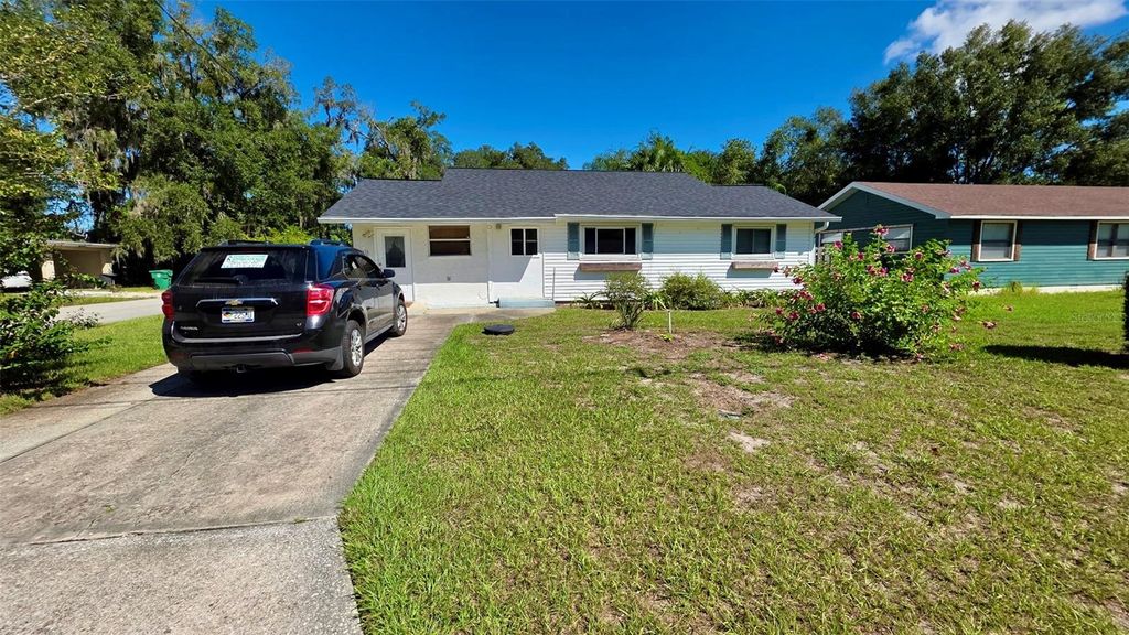 Photo of 811 W Wisconsin Avenue, Deland, FL 32720 (MLS # O6359889)