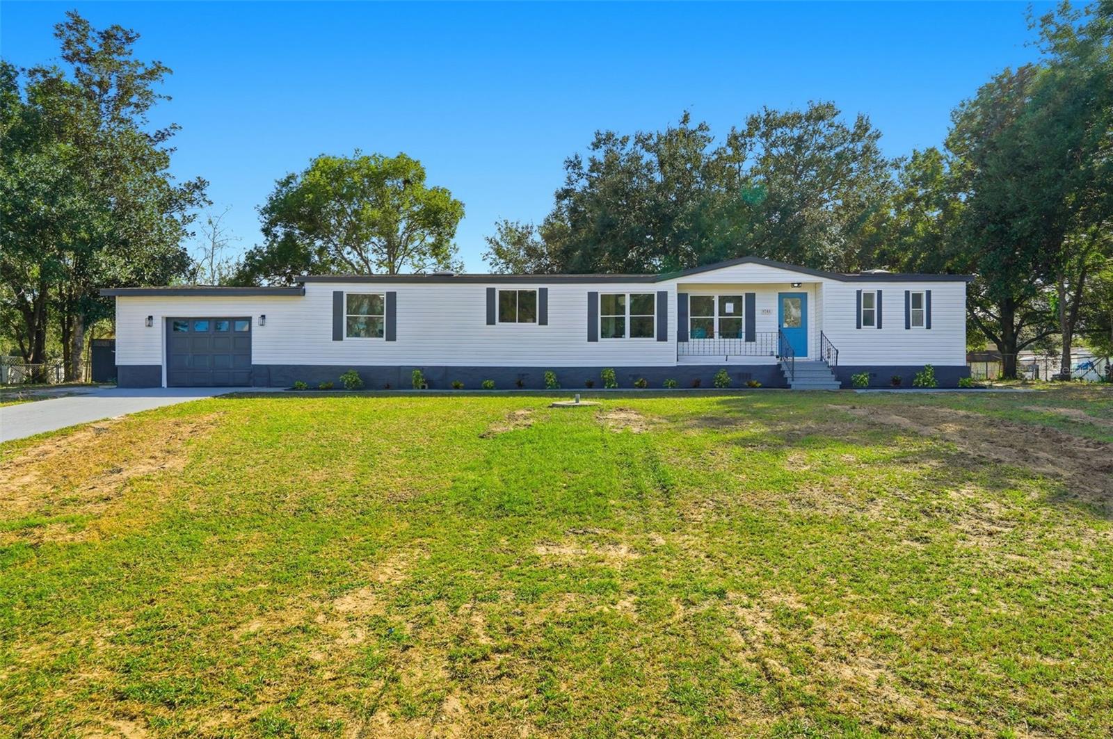 **Fully Renovated 3 Bedroom, 2 Bath Home with Oversized Garage on Half Acre in Dade City – No HOA, No Flood Zone**
Welcome to this beautifully updated 3-bedroom, 2-bathroom manufactured home sitting on over half an acre (.52 acres) in peaceful Dade City. This property offers a rare combination of modern upgrades, open space, and functionality — complete with an oversized garage perfect for storage, hobbies, or parking a vehicle.
Step inside to discover a completely remodeled interior featuring luxury vinyl tile flooring throughout, a brand-new kitchen with white real wood shaker cabinets, dovetail soft-close drawers, soft-close doors, quartz countertops, a modern herringbone glass backsplash, and stainless steel appliances. Both bathrooms have been tastefully renovated with stylish finishes, new vanities, and updated fixtures. The primary bathroom has free-standing soaking tub with separate shower, spacious vanity with quartz countertop and separate water closet (toilet). 
Enjoy fresh paint inside and out, a new roof and newer A/C, and upgraded lighting throughout. The open split floor plan provides plenty of natural light and comfortable living spaces for family and guests alike.
Outside, the spacious .52-acre lot provides room to relax, enjoy time around the large brick fire ring, garden, or add outdoor amenities — all with no HOA restrictions. Conveniently located near charming downtown Dade City, shopping, and local dining, this home blends peaceful living with modern comfort.
Schedule your private showing today!