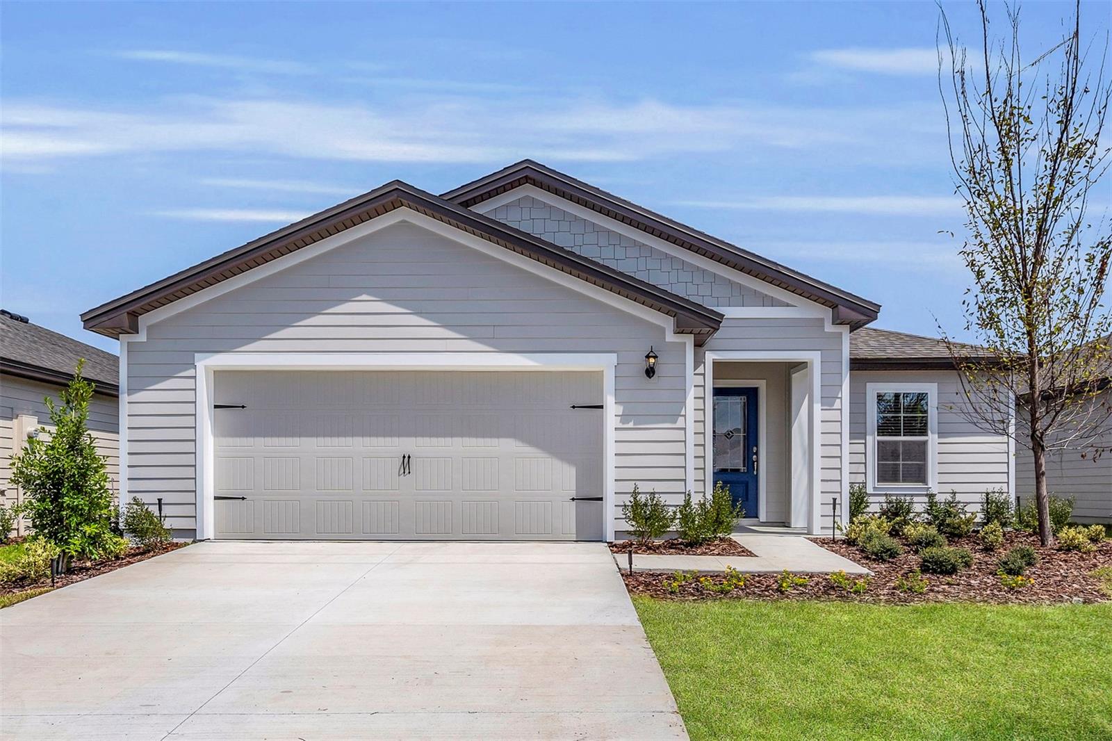 Under Construction. Welcome to the St. Martin, a brand-new LGI home in the vibrant Marion Oaks community! This thoughtfully designed 3-bedroom, 2-bathroom home offers exceptional value, comfort, and style. Enjoy your morning coffee on the charming covered front porch, surrounded by professional front yard landscaping. Inside, an open-concept layout connects the upgraded kitchen with the dining and living areas—perfect for family time and entertaining.
The chef-ready kitchen features a full suite of stainless steel Whirlpool appliances, granite countertops, and ample cabinet space. Retreat to the spacious master bedroom, which boasts a large walk-in closet and a private en-suite bath. With modern finishes and a smart, functional layout, the St. Martin offers contemporary living at its finest.
Marion Oaks residents enjoy access to a wide range of amenities including a community gym (membership just $10/month), a public library, splash pad, basketball and pickleball courts, and a bustling community center. For added peace of mind, the Marion County Sheriff's Office also has a substation located right in the community.