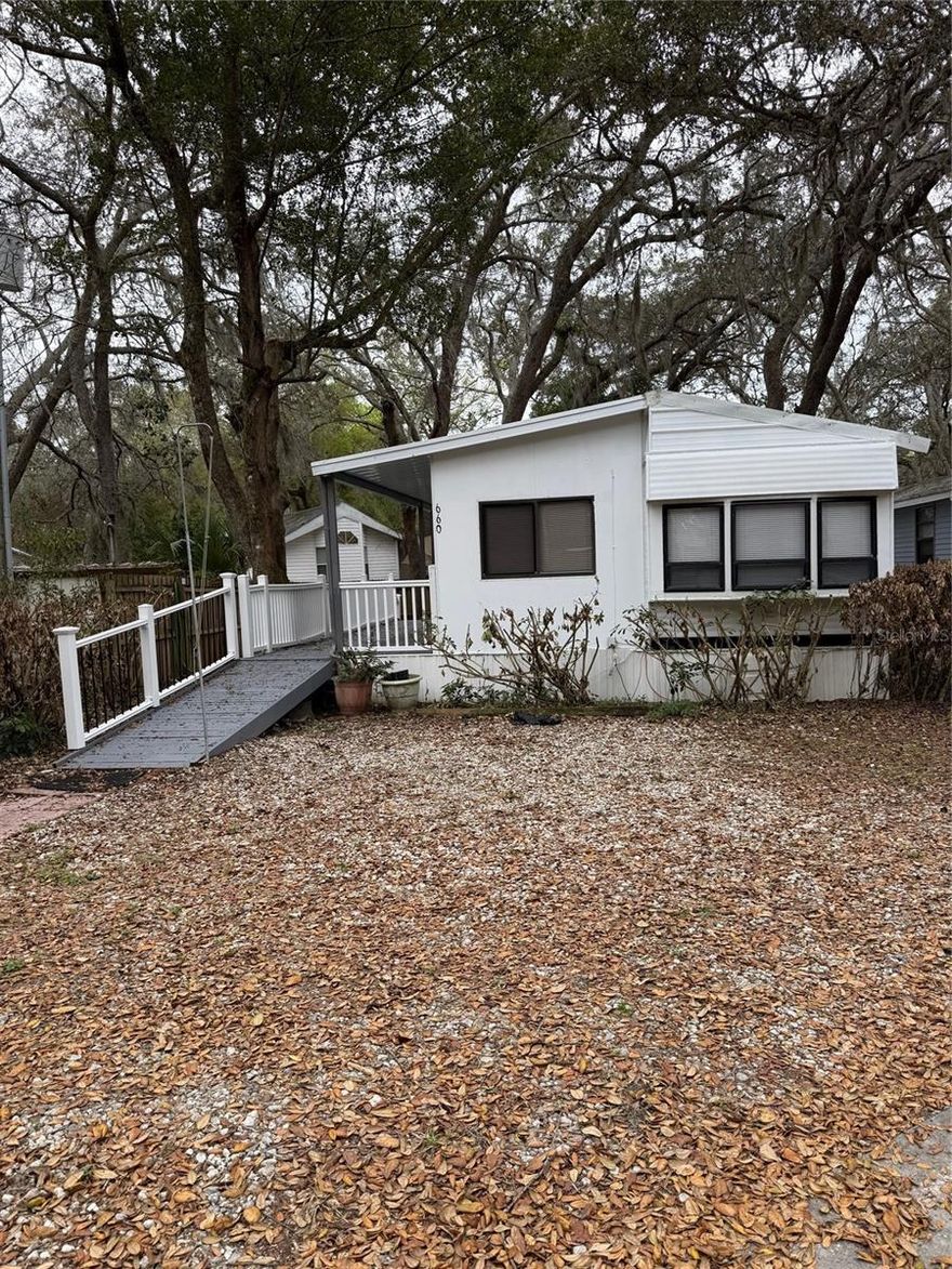 2 bedroom 1 bath park model home with large deck, utility shed with washer and dryer hook ups.