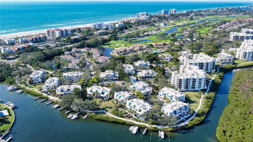 Nestled within Bay Isles, one of Longboat Key’s most notable communities, this beautifully updated townhome is tucked among mature trees and lush foliage in the Fairway Bay enclave. This 3-bedroom, 3-bath residence offers 2,135 square feet of stylish living primarily across the two main levels. A thoughtfully selected color palette and professional design give the home an ensured elevated feel, presenting as a true showcase residence.

The main living space features a reimagined, open chef-inspired kitchen designed for entertaining, complete with high-end appliances, ample prep space, and seamless connection to the living and dining areas. Soaring ceilings in the adjacent living room enhance the sense of openness, creating an inviting environment equally suited for everyday living and entertaining.

The home is thoughtfully arranged across three levels. The ground level includes a two-car garage, storage, and a generously sized area behind the garage, offering flexible bonus space. The main floor (second level) features the primary living areas, two bedrooms (one currently used as a den), two guest baths, and a laundry room. The top floor (third level) is devoted to a loft TV room and the primary suite, flanked by two terraces. The atrium-style primary bath features a soaking tub and spa shower with steam and is splashed with natural light.

One of the most coveted features is deeded private beach access, located less than half a mile from the property. Residents of Fairway Bay enjoy an amenity package that includes a 24-hour guard gate, clubhouse, fitness center, two heated pools and a spa, tennis and pickleball courts, barbecue areas, and scenic walking trails. Ownership includes exclusive membership to the Bay Isles Beach Club, a private Gulf-front retreat with a pristine beach, picnic areas, Tiki huts, grills, and updated facilities. Optional membership to the Longboat Key Club further enhances the lifestyle with access to championship golf, Har-Tru tennis courts, fine dining, a private beach club, spa services, a fitness center, and a vibrant social calendar. Everyday conveniences are right around the corner including Publix, CVS, dry cleaning, and more. This residence represents a rare offering that combines thoughtful design, resort-style amenities, and private beach access, all within one of Longboat Key’s premier gated communities.