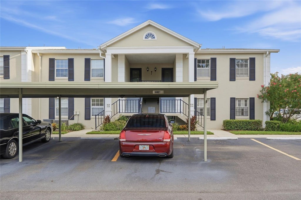 Photo of 689 Lake Howard Drive NW #213, Winter Haven, FL 33880 (MLS # L4963853)