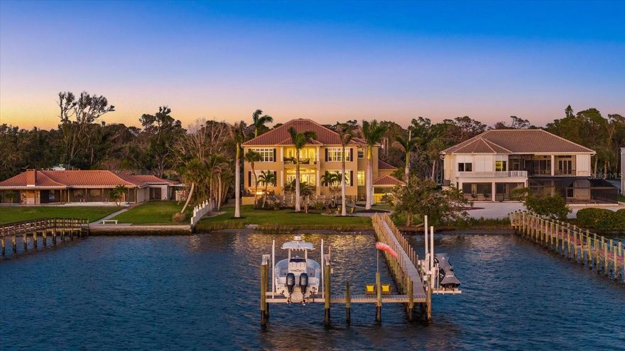 Boater’s Paradise – A Waterfront Masterpiece

Nestled on 1.37 acres of pristine waterfront along Lemon Bay and the Intracoastal Waterway, this ultra-luxury estate is a sanctuary of elegance, offering unparalleled privacy and breathtaking views. Surrounded by lush tropical landscaping and majestic royal palms, this exceptional residence blends refined design with the finest in coastal living.

Designed for both grand entertaining and intimate retreats, the home features five spacious bedrooms, five baths, and a stately executive office with a walk-in closet. A newly installed 2023 elevator ensures effortless access throughout. Boating enthusiasts will appreciate the 2018 composite dock, complete with electric, water, a 12,000-pound boat lift, and two jet ski swings, while the 2020 RV/boat barn offers ample storage for a Class A motorcoach, a boat, or up to five vehicles. An oversized three-car garage, resurfaced with a polyaspartic finish, adds to the home’s impressive accommodations.

The expansive primary suite, located on the first floor, is a true retreat, featuring breathtaking water views, two walk-in closets with custom cabinetry organizers, and a spa-like ensuite. Designed for indulgence, the ensuite boasts dual sinks, a makeup vanity, a soaking tub, and a walk-in shower that serves as the focal point—featuring both a wall-mounted shower head and a luxurious rain shower. Upstairs, four generously sized guest suites each offer an ensuite bath, providing comfort and privacy for family and guests.

Entertaining is effortless with a thoughtfully designed layout, offering a formal living room, a cozy family room, and a grand kitchen with an abundance of cabinetry and countertop space, and a dinette, while the formal dining room sets the stage for elegant gatherings.

At the heart of the home, the chef’s kitchen is a masterpiece of both form and function, featuring a Sub-Zero refrigerator, Wolf 48” range and microwave, paneled dishwasher, stunning granite countertops, two breakfast bars, and an amazing butler’s pantry with built-in cabinetry, offering additional storage and prep space for seamless entertaining.

The outdoor oasis is designed for resort-style living, featuring a resurfaced saltwater pool and spa with LED lighting, a new cabana with a covered entertaining space, and an outdoor kitchen with composite cabinetry, a built-in grill, exhaust hood, sink, and storage for boating essentials. New pavers, a decorative pool fence, a firepit, and a paver terrace with a built-in propane fire table complete the exceptional outdoor living experience.

This waterfront property is set in a truly unique location, offering both tranquility and convenience. Boaters will love the easy access to open water, with the Gulf of Mexico just 20 minutes north via the Venice Jetties, or 20 minutes south via Stump Pass. The vibrant lifestyle of the area is within easy reach, with boutique shopping and fine dining just a 10–20 minute drive away.

Built with security and efficiency in mind, the home is elevated on a stem wall, fitted with PGT impact windows with thermal tint, and experienced NO WATER INTRUSION in the living space. The owned 2023 solar system keeps electric costs remarkably low at approximately $27 per month. Additional features include public water, a well for irrigation, Fiber FIOS, a security system, and a long, high-quality concrete driveway.

Video: https://iframe.videodelivery.net/550bfc84fca6ea91d0ee87961165fa2b