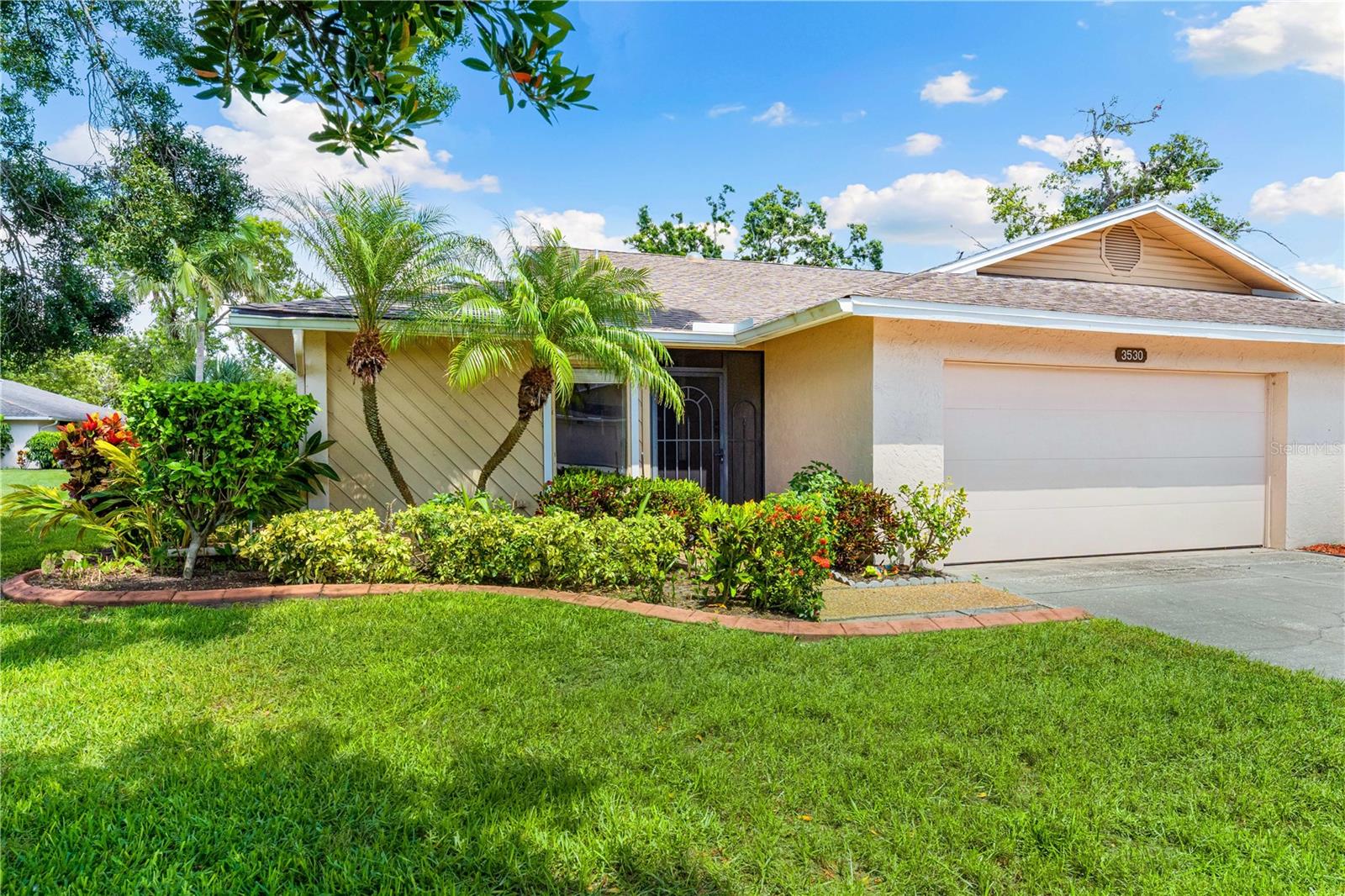 Live the Florida Dream in this Maintenance-Free Villa! Welcome to your own private sanctuary—this spacious, light-filled villa offers peaceful water views, modern updates, and a lifestyle you’ll love. Step onto the covered lanai and unwind as you watch herons and turtles by the pond, all from the comfort of your own backyard. Inside, you'll find an updated kitchen with sleek stainless steel appliances, a smart split floor plan for added privacy, and a large master suite designed for relaxation. The versatile den features custom built-in bookshelves and a hidden Murphy bed—perfect for hosting guests or creating the ultimate home office. A separate laundry room with ample storage and an oversized two-car garage add convenience to everyday living. Located in an active, pet-friendly (not 55+) community, you’ll enjoy resort-style amenities including a heated pool, tennis court, and a welcoming clubhouse with year-round activities. Cable & internet are include in condo fees. Centrally located within Sarasota, you are 10 minutes to the beach & downtown, plus you'll be around the corner from shopping and restaurants! Whether you're looking for a full-time residence or a seasonal retreat, this villa has it all—location, comfort, and lifestyle! Be sure to watch the virtual tour and call for a detailed brochure.