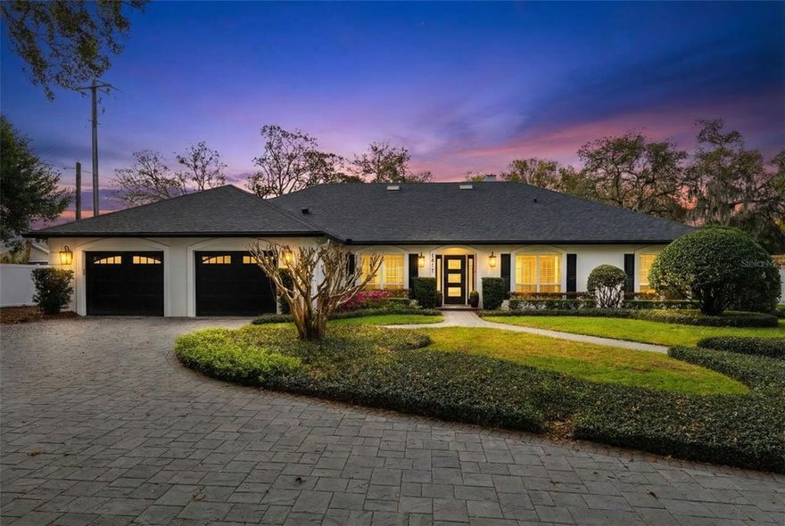 Welcome to this stunning home in Maitland, located at 1817 Braeloch Ct. A welcoming foyer opens to elegant formal living and dining rooms featuring gorgeous fixtures, plantation shutters throughout, 5½-inch baseboards, and beautiful manufactured wood flooring. Vaulted ceilings and skylights fill the home with natural light, while a cozy wood-burning fireplace and stylish wet bar create the perfect setting for entertaining.

The completely renovated kitchen by Braden Kitchens offers abundant cabinetry and storage, with even more storage available in the spacious laundry room. The luxurious primary suite has been fully updated and features a beautifully redone bathroom and a custom built-in closet system.

Step outside to a private screened pool and an impressive redesigned porch with pavers, vaulted ceilings, and skylights—perfect for relaxing or hosting guests. The home also includes a convenient half bath, two additional bedrooms with walk-in closets, a second bathroom that serves as a pool bath with a shower and linen closet, and a third bedroom with French doors leading directly to the pool area.

Additional highlights include a central vacuum system, an oversized two-car garage, a shingle roof installed in 2021, A/C (2018), and a newer water heater for peace of mind. Residents also enjoy HOA community access to a private boat ramp and dock on the lake, which features a private skiing and slalom course. Boat storage at the private dock may also be available for an additional $100 per year, offering even more convenience for enjoying the Florida waterfront lifestyle.