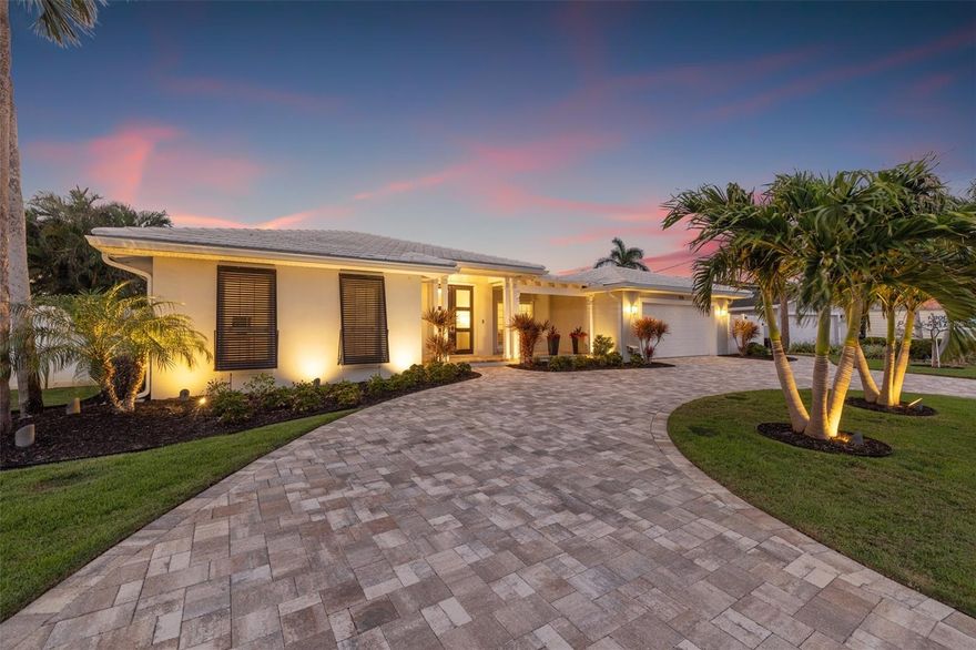 Coastal Waterfront Luxury on Snell Isle in the peaceful enclave of Eden Isle. (THIS HOME DID NOT EXPERIENCE ANY DAMAGE OR WATER INTRUSION FROM RECENT HURRICANES) Experience effortless coastal luxury living in this beautifully updated waterfront pool home with new seawall, dock and boat lifts. Perfectly positioned on Smacks Bayou with instant access to Tampa Bay, this exceptional residence offers a well-designed living space, featuring two private primary suites, a split floor plan, and seamless indoor-outdoor flow that defines the relaxed sophistication of St. Petersburg’s coastal lifestyle. From the moment you enter, you’ll appreciate the home’s versatile layout, which includes both formal and casual living and dining areas—perfect for hosting guests or enjoying quiet evenings at home. At the heart of the home, the thoughtfully designed kitchen blends functionality with elevated style. It features a large center island, custom wood cabinetry, stainless steel appliances, a wine refrigerator, and a convenient pass-through window to the covered lanai—ideal for entertaining and everyday living. The main primary suite is a peaceful and private retreat, offering two generous walk-in closets and a newly updated en suite bathroom with dual sinks and a spa-like glass-enclosed shower. The second primary suite—ideal as a guest suite, home office, or den—features a charming bay window that perfectly frames stunning water views, an en suite bath that also serves as a convenient pool bath, and its own private space tucked away for comfort and flexibility. Step outside and embrace the ultimate St. Pete lifestyle from your own tropical oasis. Watch dolphins and manatees play in the bayou as you sip your morning coffee, or unwind in the evening with a cocktail and a vibrant sunset. The outdoor space is designed for year-round enjoyment, featuring a resort-style pool and spa, a fully equipped outdoor kitchen, and lush, private landscaping. A newer paver walkway connects the pool area to the dock, completed in 2022, which features a 16,000 lb boat lift and a 1,500 lb PWC lift—your personal launch point to Tampa Bay, the Gulf beaches, or a quick boat ride to downtown St. Pete or Tampa. Additional upgrades include impact-rated windows and doors throughout, a new seawall, a new paver driveway and front porch (2022), a four-zone AC system installed in June 2024 and all new PVC pipe installed. *** Best of all, this home has had no water intrusion during recent hurricanes ***  a valuable reassurance for waterfront living. Ideally located just minutes from everything that makes St. Pete one of Florida’s most desirable coastal cities, this home allows you to take your golf cart downtown for Michelin-starred dining, sidewalk cafés, boutique shopping, world-renowned museums, the St. Pete Pier, and miles of scenic waterfront parks. Everyday conveniences like Whole Foods, Trader Joe’s, Publix, and Fresh Market are all nearby along the vibrant 4th Street Corridor. Whether you’re searching for a full-time residence or a luxurious waterfront retreat, this exceptional home perfectly captures the essence of modern coastal living in the heart of St. Petersburg.