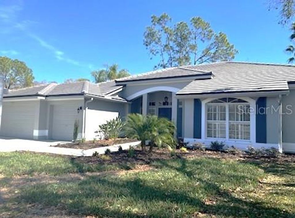 Photo of 1003 Berkshire Lane, Tarpon Springs, FL 34688 (MLS # TB8370121)