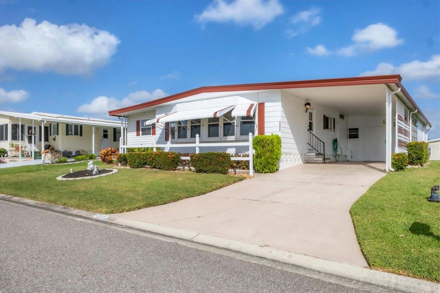 Welcome Home to this Turn-key furnished gem in Tidevue Estates 55+ community—where you own the land! This home offers peaceful green space views and an open deck off the Florida room, perfect for morning coffee or evening relaxation. The spacious living room flows into the kitchen featuring a double oven, faux butcher block countertops, and a breakfast bar ideal for casual dining. The primary suite features a walk-in closet and an en-suite bathroom with a tub/shower combination. Recent updates include a 2-year-old AC and fresh exterior paint in 2024. A standout feature is the oversized 22x13 shed with a workbench—ideal for hobbies, crafts, or extra storage. Create your outdoor living room under the carport which has glass windows and still room to park your car. Enjoy active living in this vibrant community with no lot rent. Low HOA of only $600 annually. Pets are not permitted. Plenty of activities to keep you busy in this community. Take a water aerobics class in the solar-heated community pool or work on your tan. The community library offers a free Wi-Fi connection. Updated fitness center. Meet friends and make new ones for a game of indoor pickleball, bocce ball, or shuffleboard. Join the Golf League. Take a bike or golf cart ride to Veterans' Park to watch the wildlife and sunset. Ellenton Premium Outlet Mall, restaurants, and medical facilities are just minutes away. Easy access to I-75. Not to mention a short drive to our beautiful Gulf Beaches.